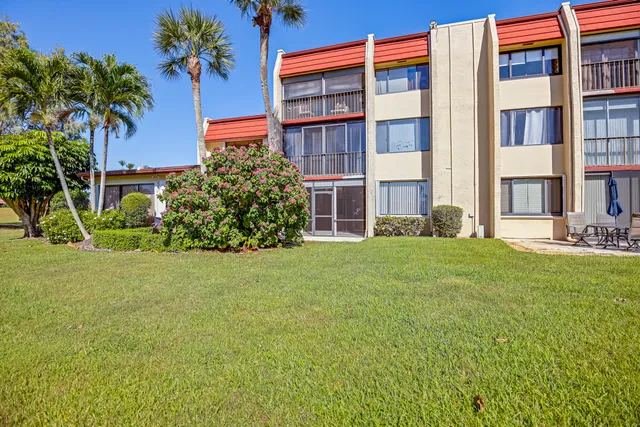 a view of a building with a yard
