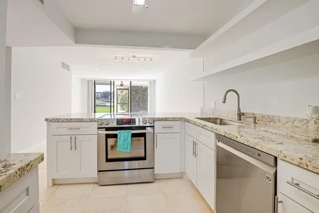 a kitchen with a stove and a sink