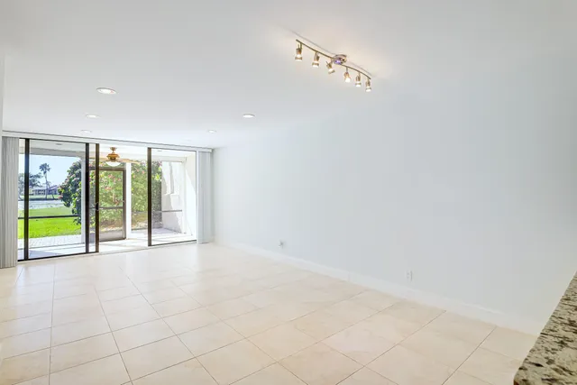 a view of an empty room with a sliding door
