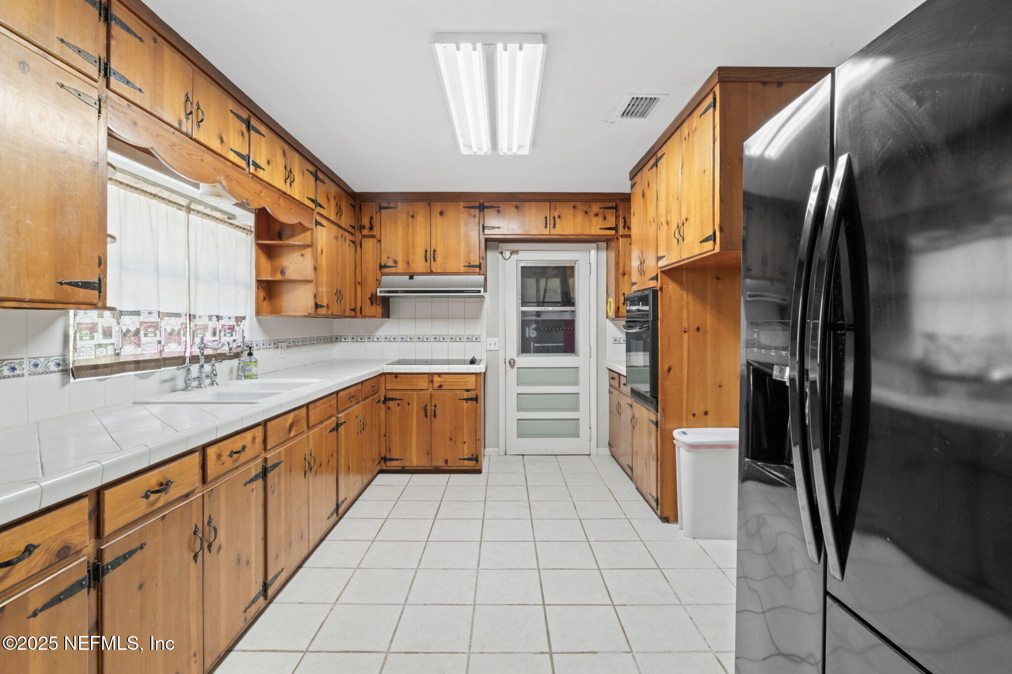 17896 Highway 16 Starke, FL 32091 - Photo 12 of 57 a kitchen with stainless steel appliances granite countertop a refrigerator and a sink