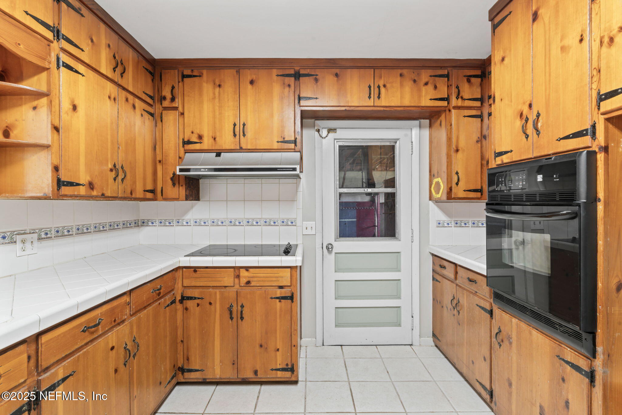 17896 Highway 16 Starke, FL 32091 - Photo 14 of 57 a kitchen with stainless steel appliances cabinets and a counter top space