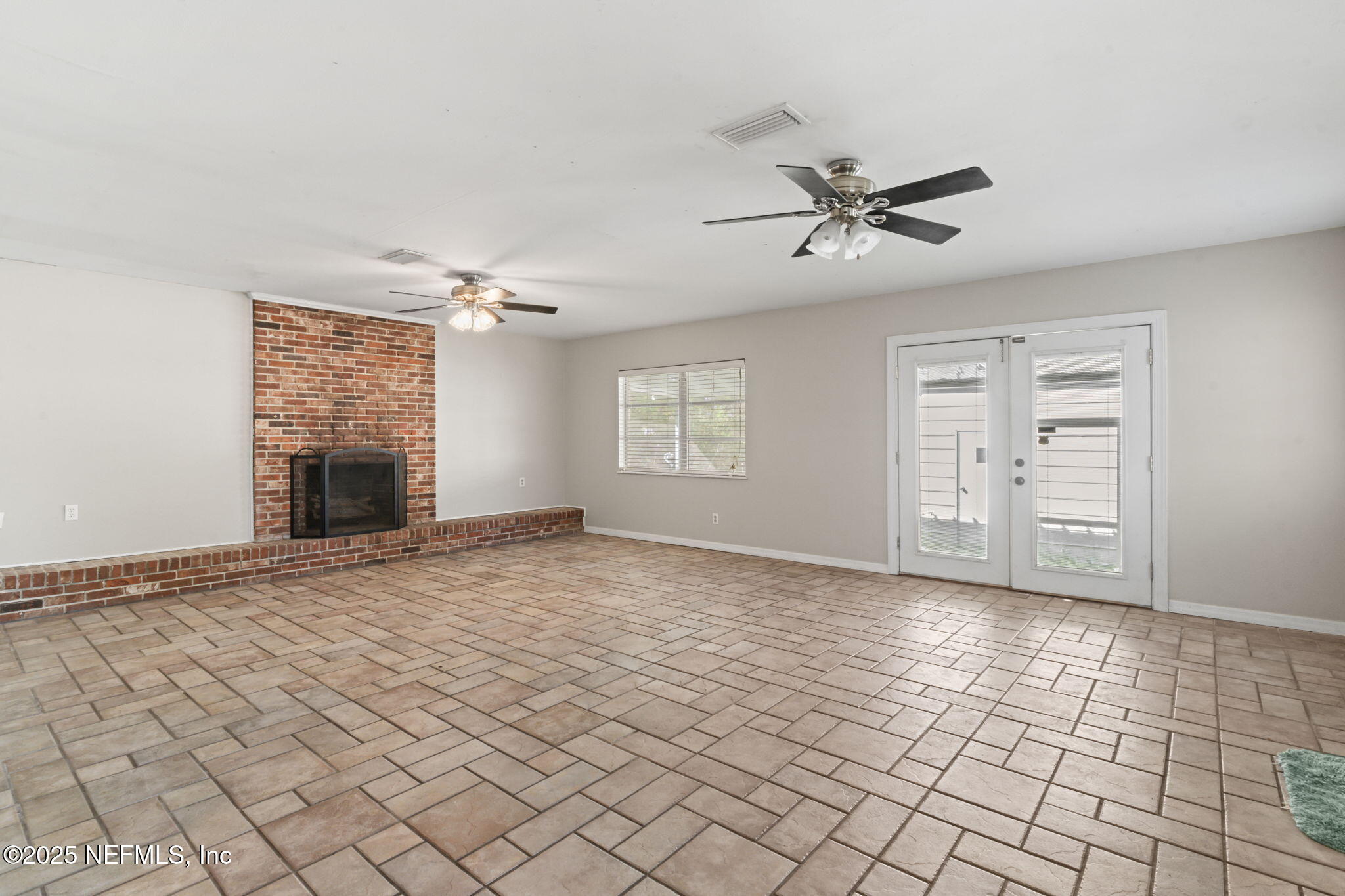 17896 Highway 16 Starke, FL 32091 - Photo 20 of 57 a view of an empty room with a window and fireplace