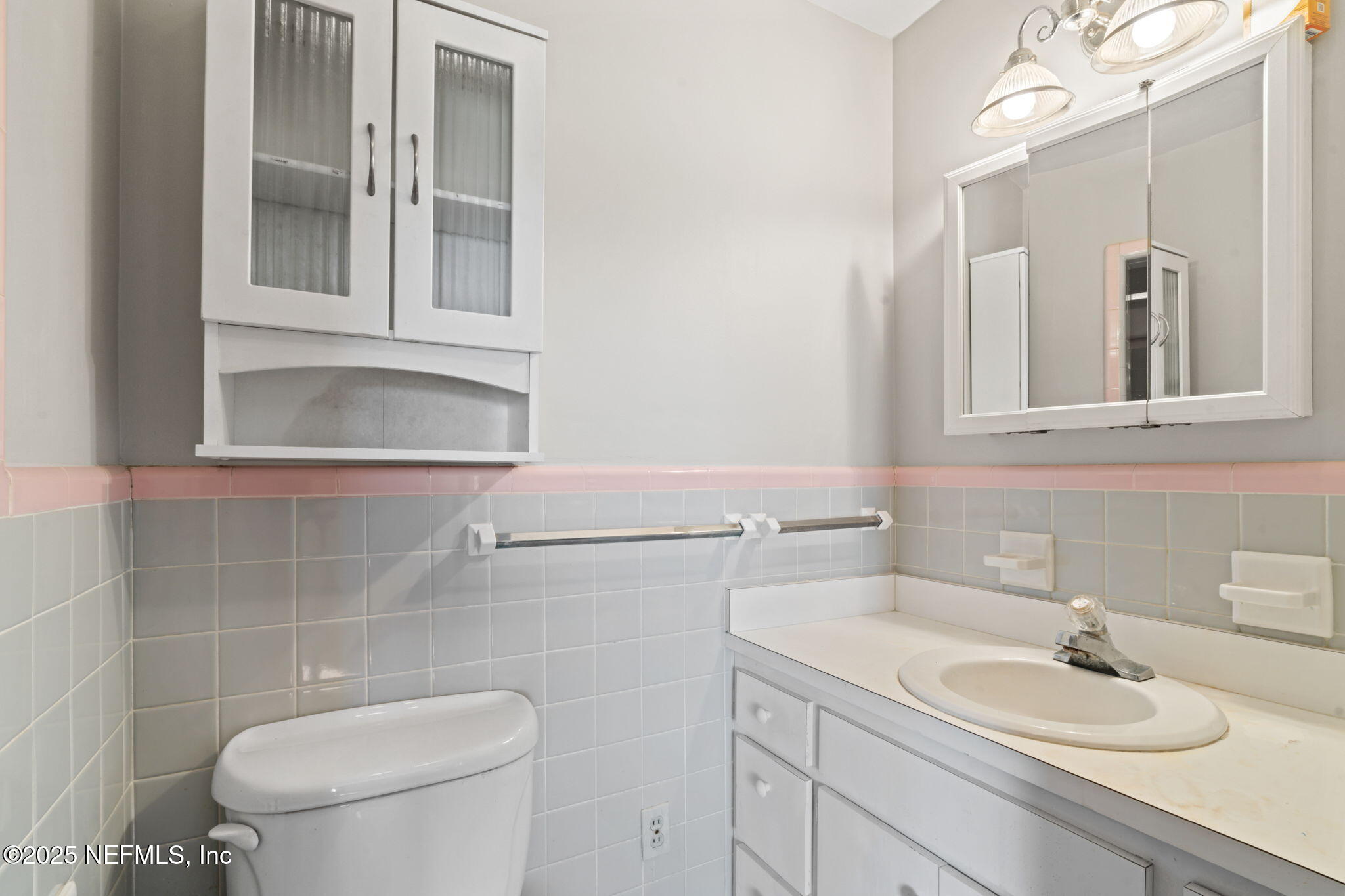 17896 Highway 16 Starke, FL 32091 - Photo 28 of 57 a bathroom with a toilet a sink and mirror