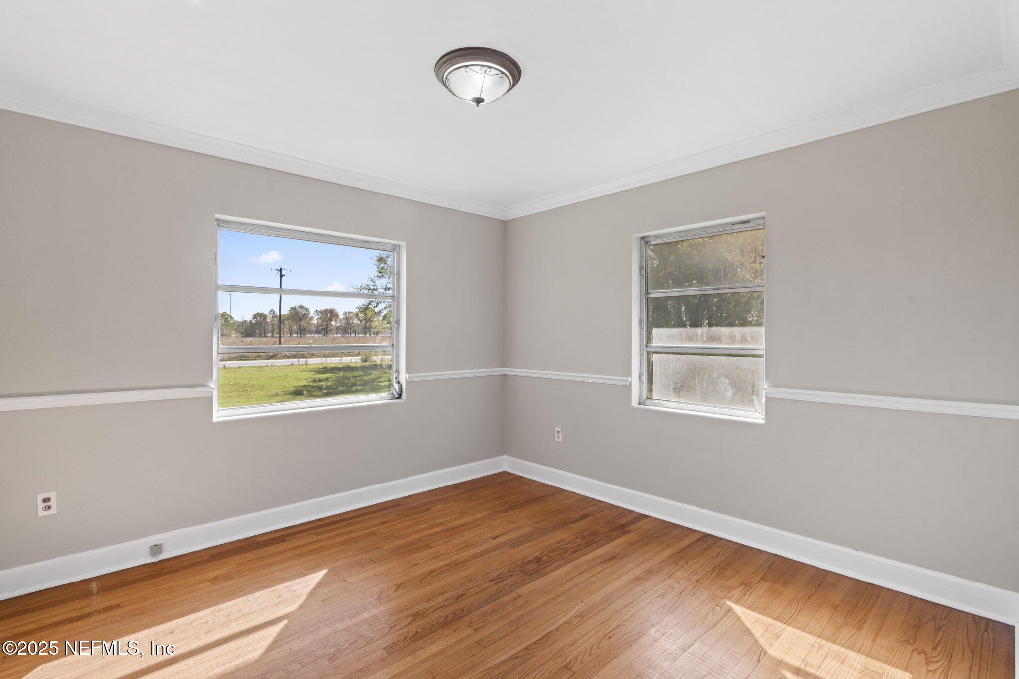 17896 Highway 16 Starke, FL 32091 - Photo 30 of 57 a view of an empty room with wooden floor and a window
