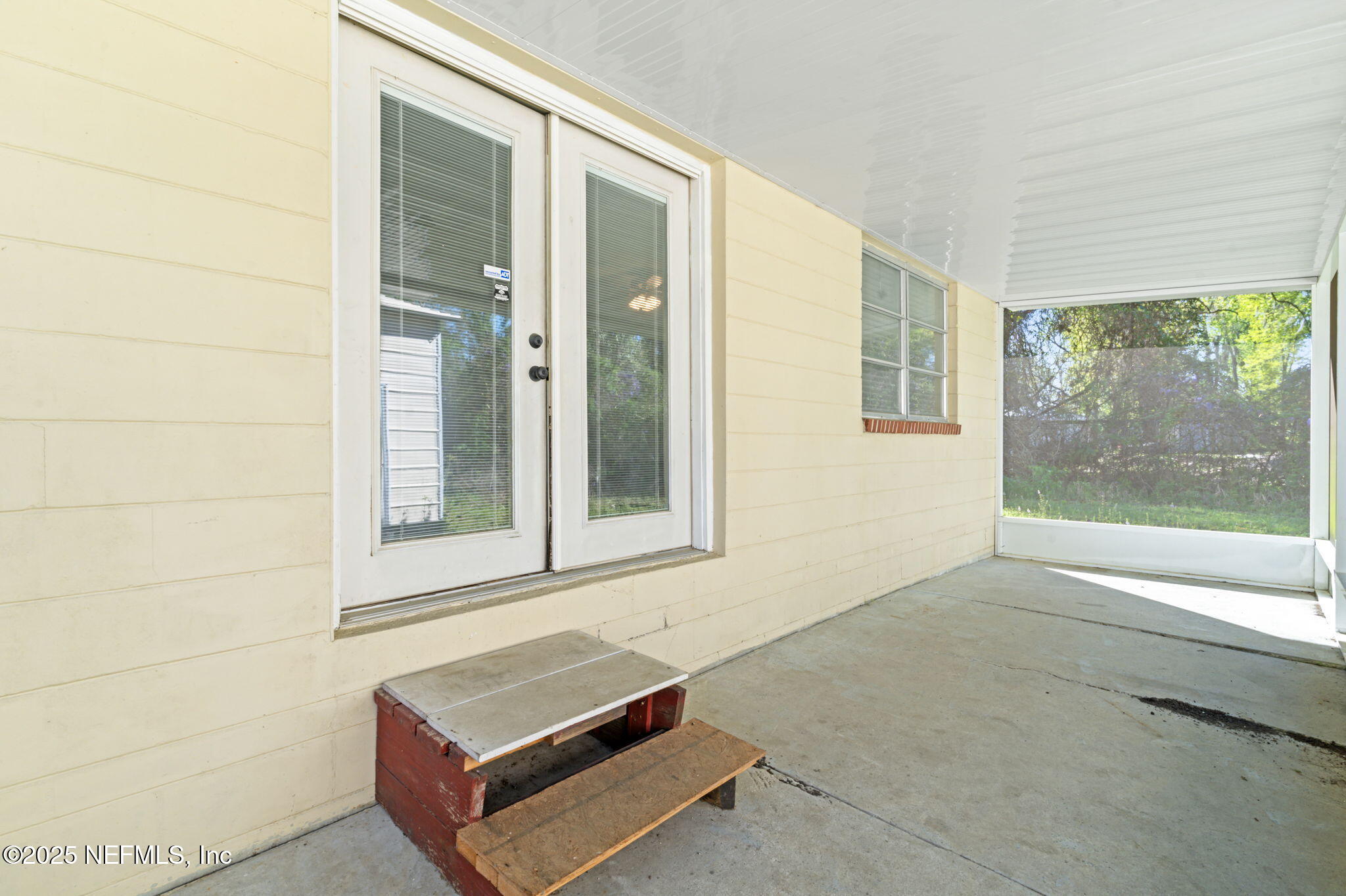 17896 Highway 16 Starke, FL 32091 - Photo 35 of 57 a view of an empty room with wooden floor and a window
