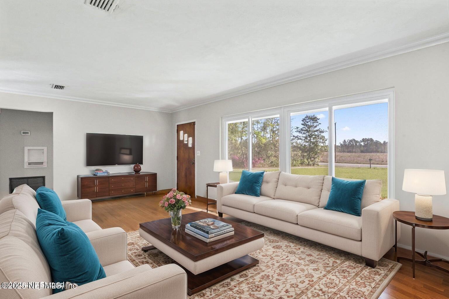17896 Highway 16 Starke, FL 32091 - Photo 4 of 57 a living room with furniture and a flat screen tv