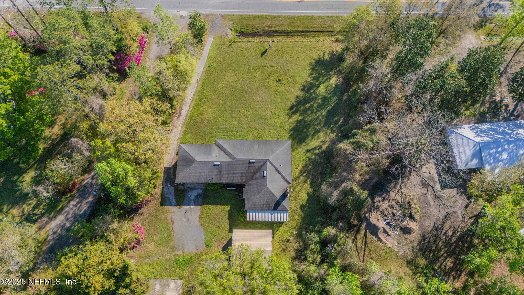 17896 Highway 16 Starke, FL 32091 - Photo 53 of 57 an aerial view of a house with a yard