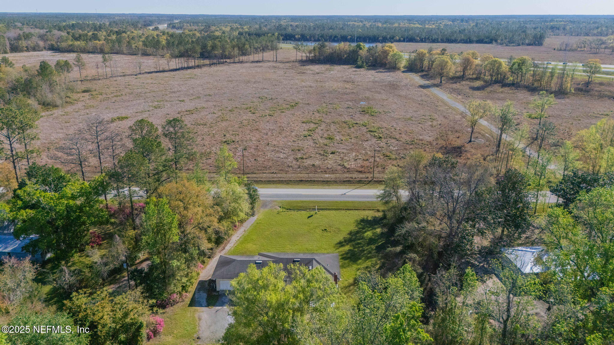 17896 Highway 16 Starke, FL 32091 - Photo 54 of 57 an aerial view of a house with a yard