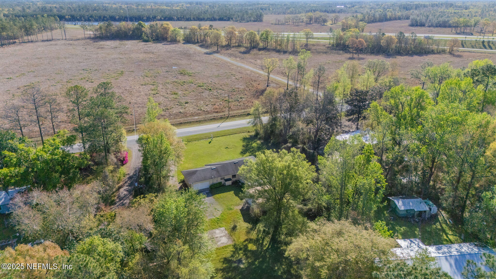 17896 Highway 16 Starke, FL 32091 - Photo 55 of 57 a view of a lake with a yard and large trees