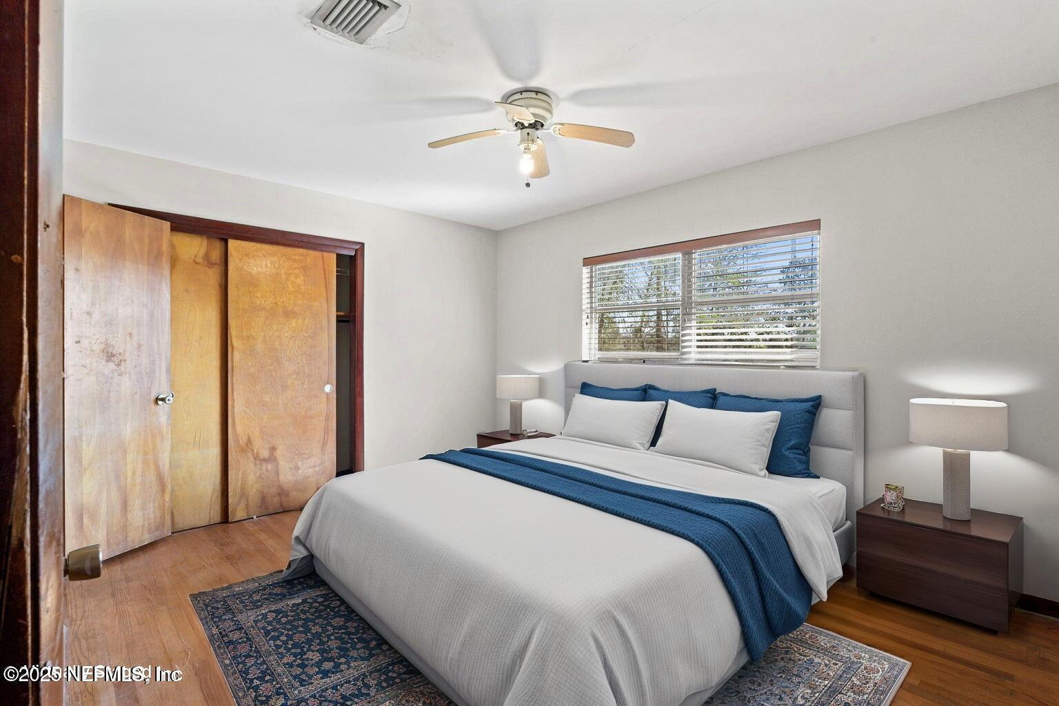 17896 Highway 16 Starke, FL 32091 - Photo 7 of 57 a bedroom with a large bed and a chandelier