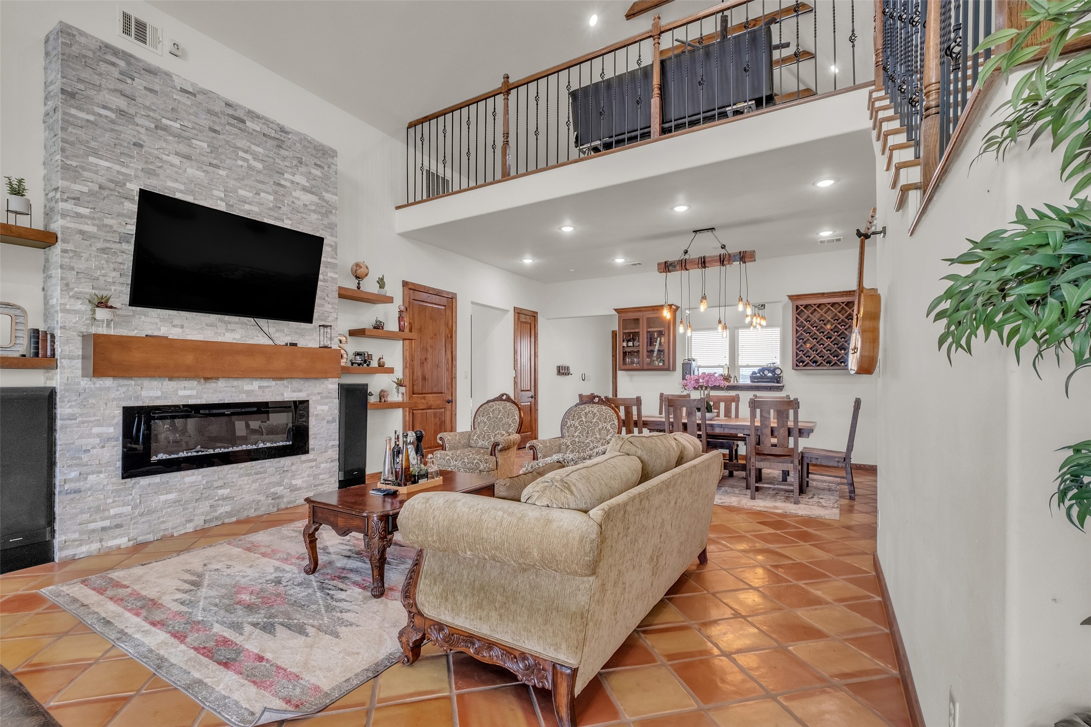1048 11th Street Columbus, TX 78934 - Photo 16 of 48 a living room with furniture a flat screen tv and a fireplace