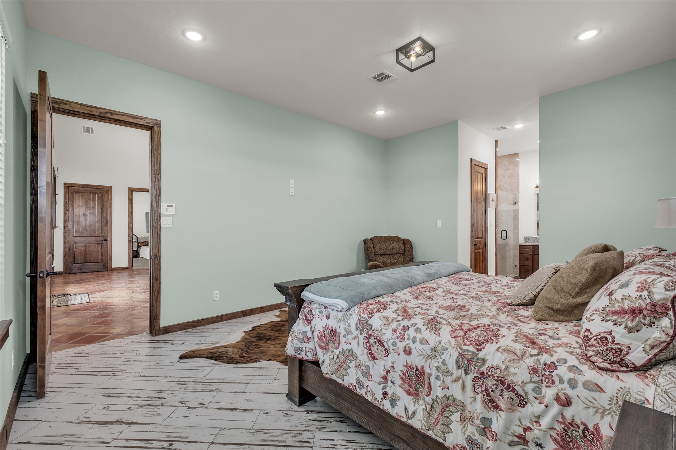 1048 11th Street Columbus, TX 78934 - Photo 21 of 48 a bedroom with a bed and a mirror