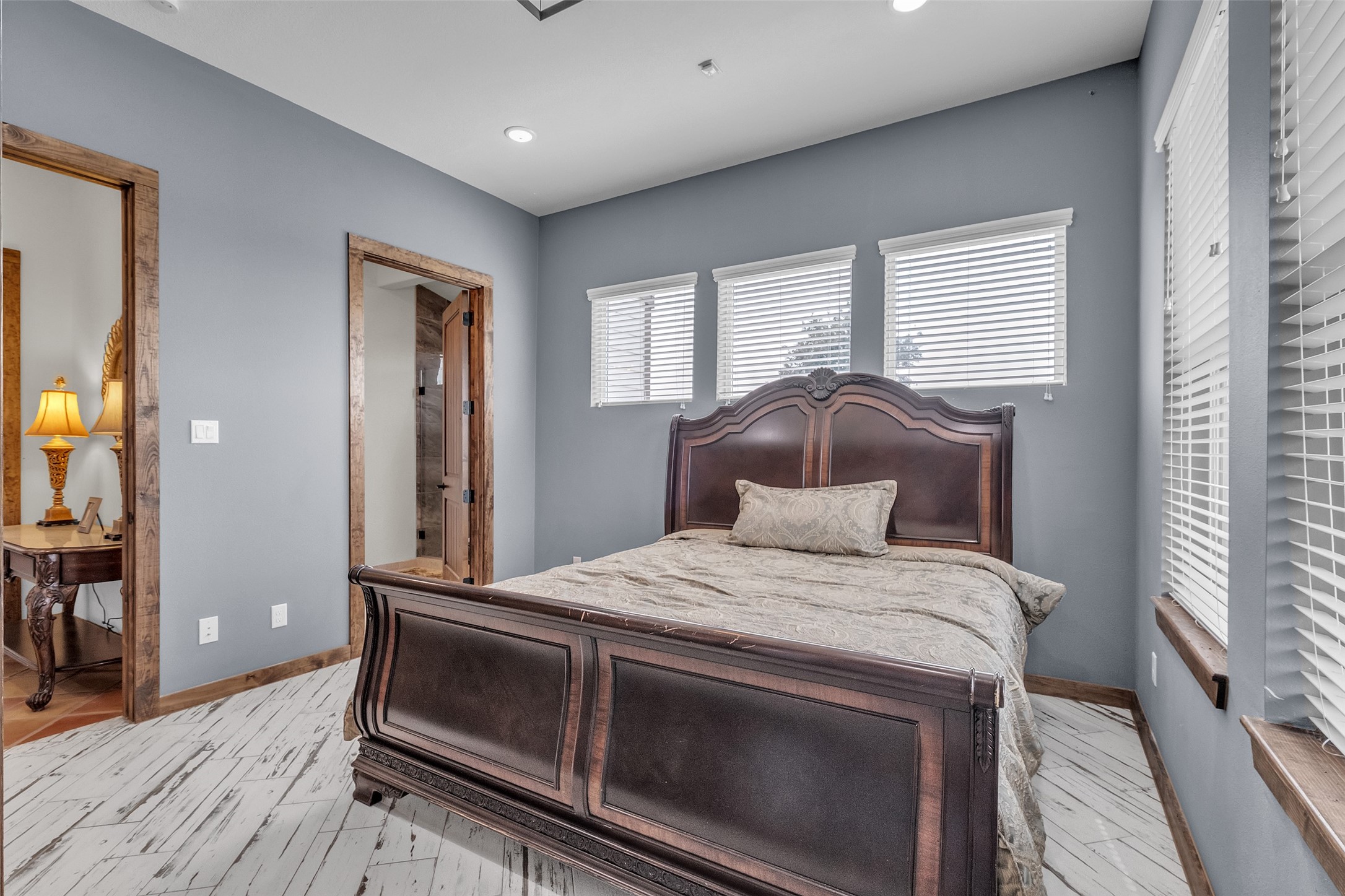 1048 11th Street Columbus, TX 78934 - Photo 24 of 48 a bedroom with a bed and a large window