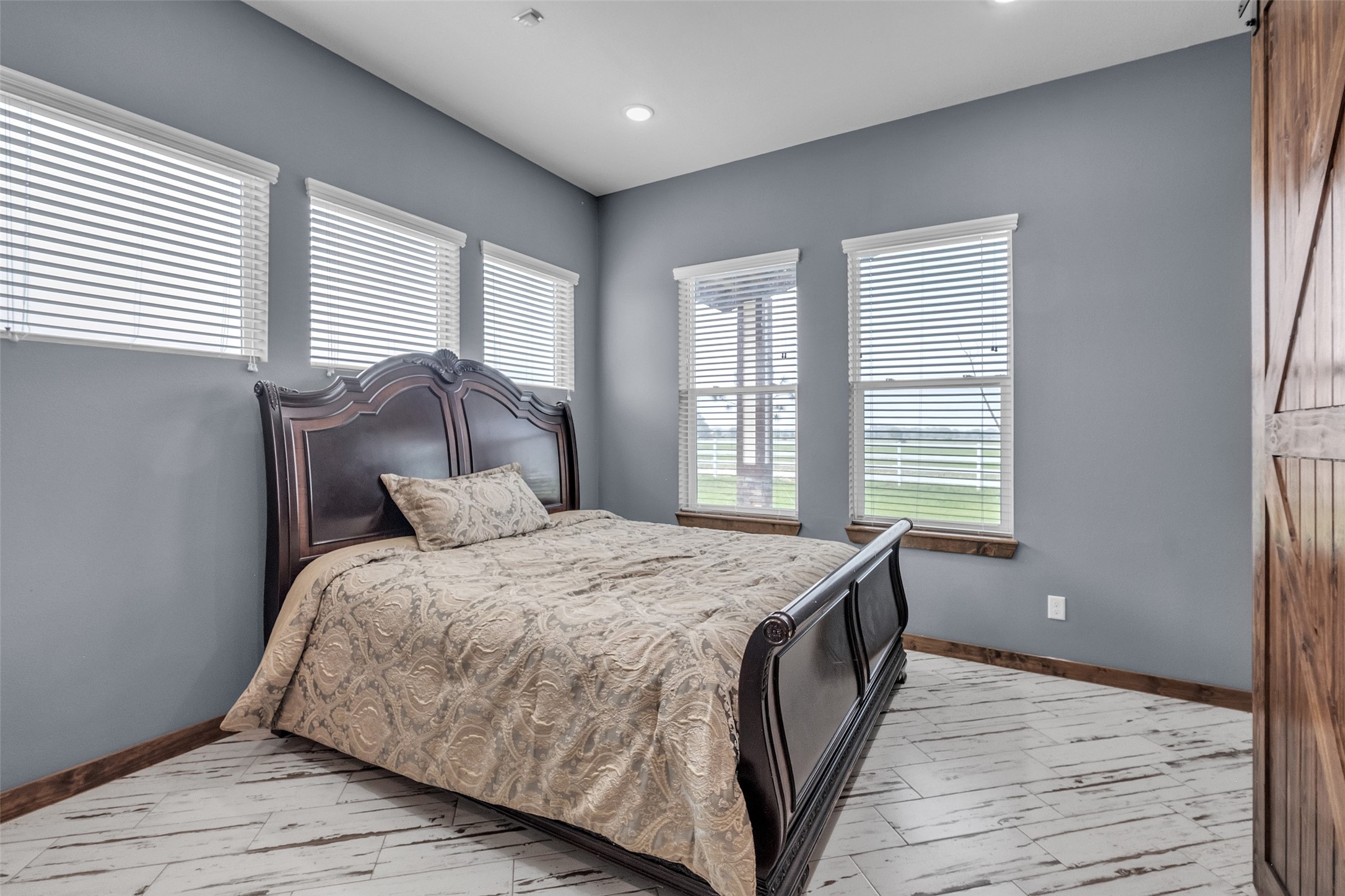 1048 11th Street Columbus, TX 78934 - Photo 25 of 48 a bedroom with a bed and a large window