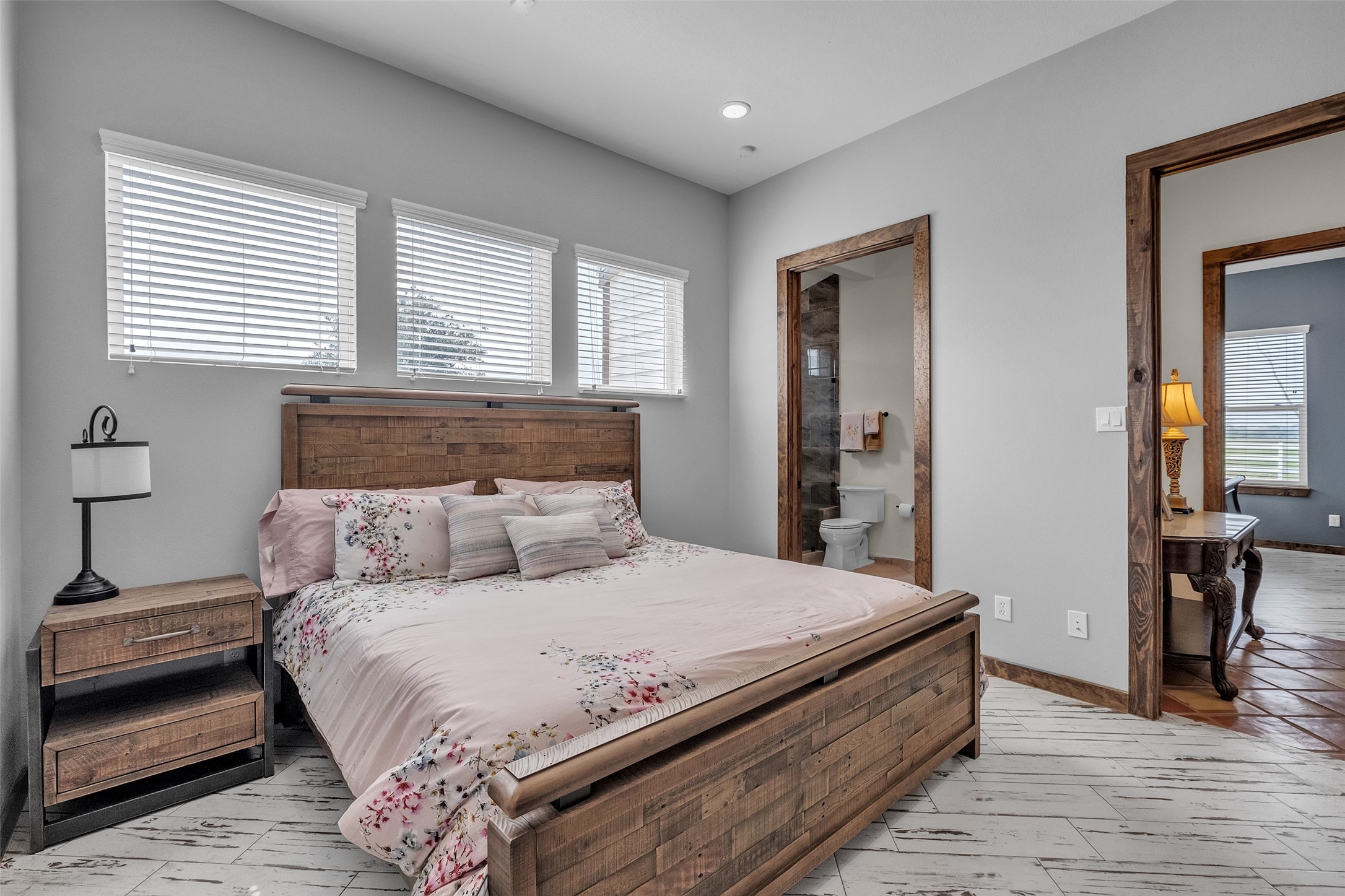 1048 11th Street Columbus, TX 78934 - Photo 30 of 48 a large bed sitting in a bedroom next to a window