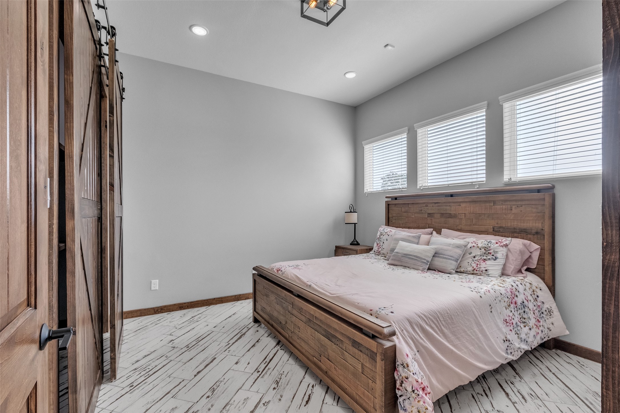 1048 11th Street Columbus, TX 78934 - Photo 31 of 48 a bedroom with a bed and wooden floor