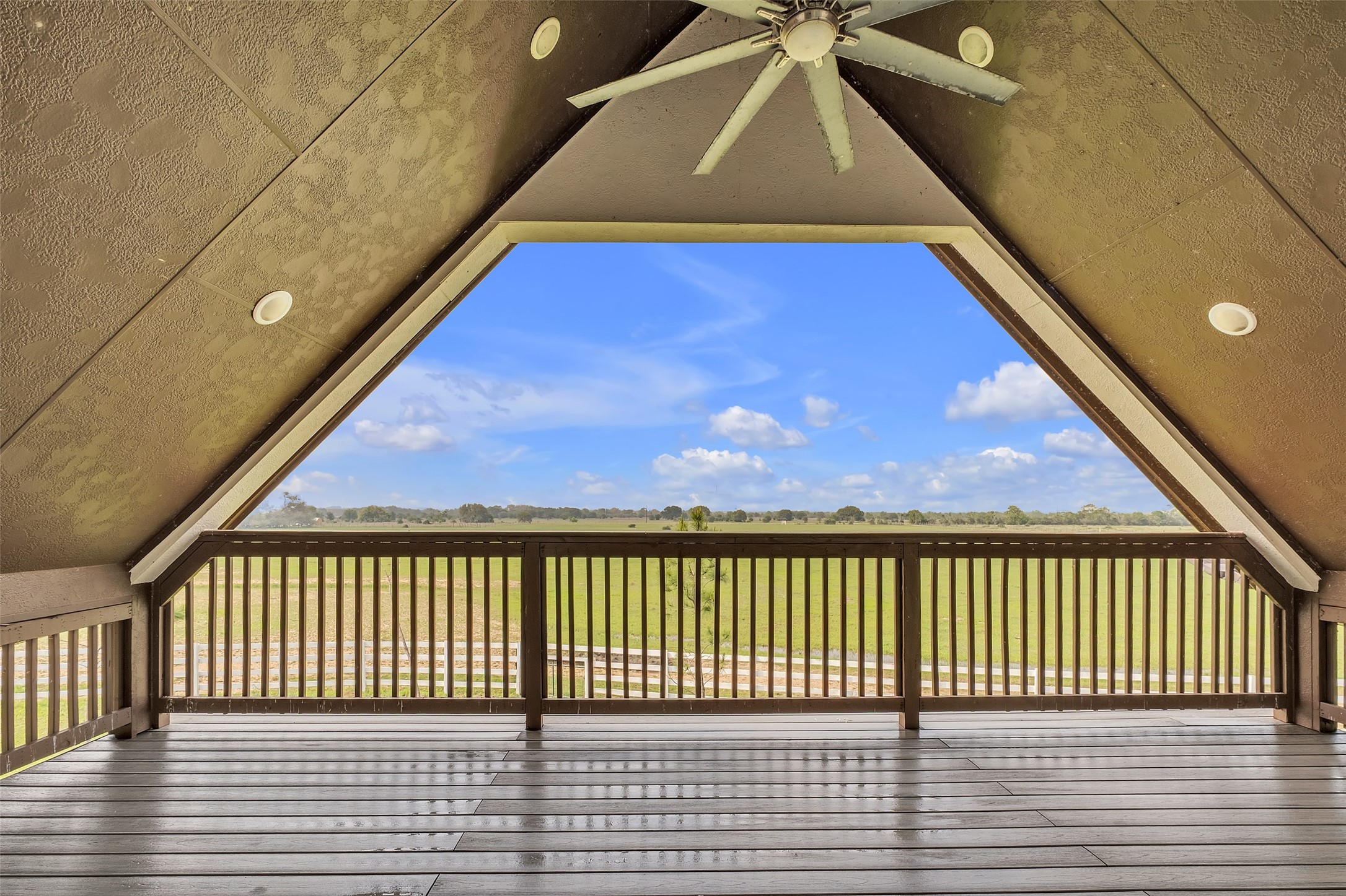 1048 11th Street Columbus, TX 78934 - Photo 37 of 48 a view of a balcony with wooden floor