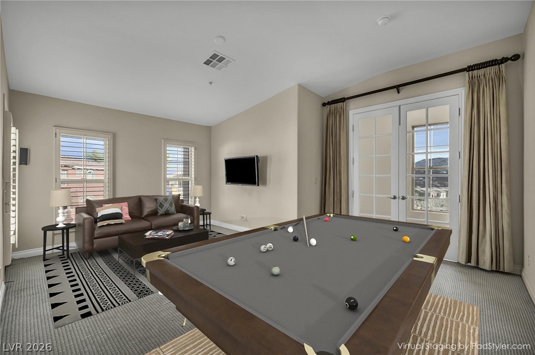 75 Luce Del Sole, Unit 3 Henderson, NV 89011 - Photo 20 of 56 "Virtually Stagged" Entertain guests in this recreation room featuring French doors and ample space for a pool table.