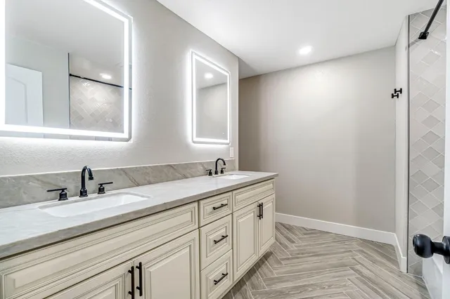 a bathroom with a sink and a mirror