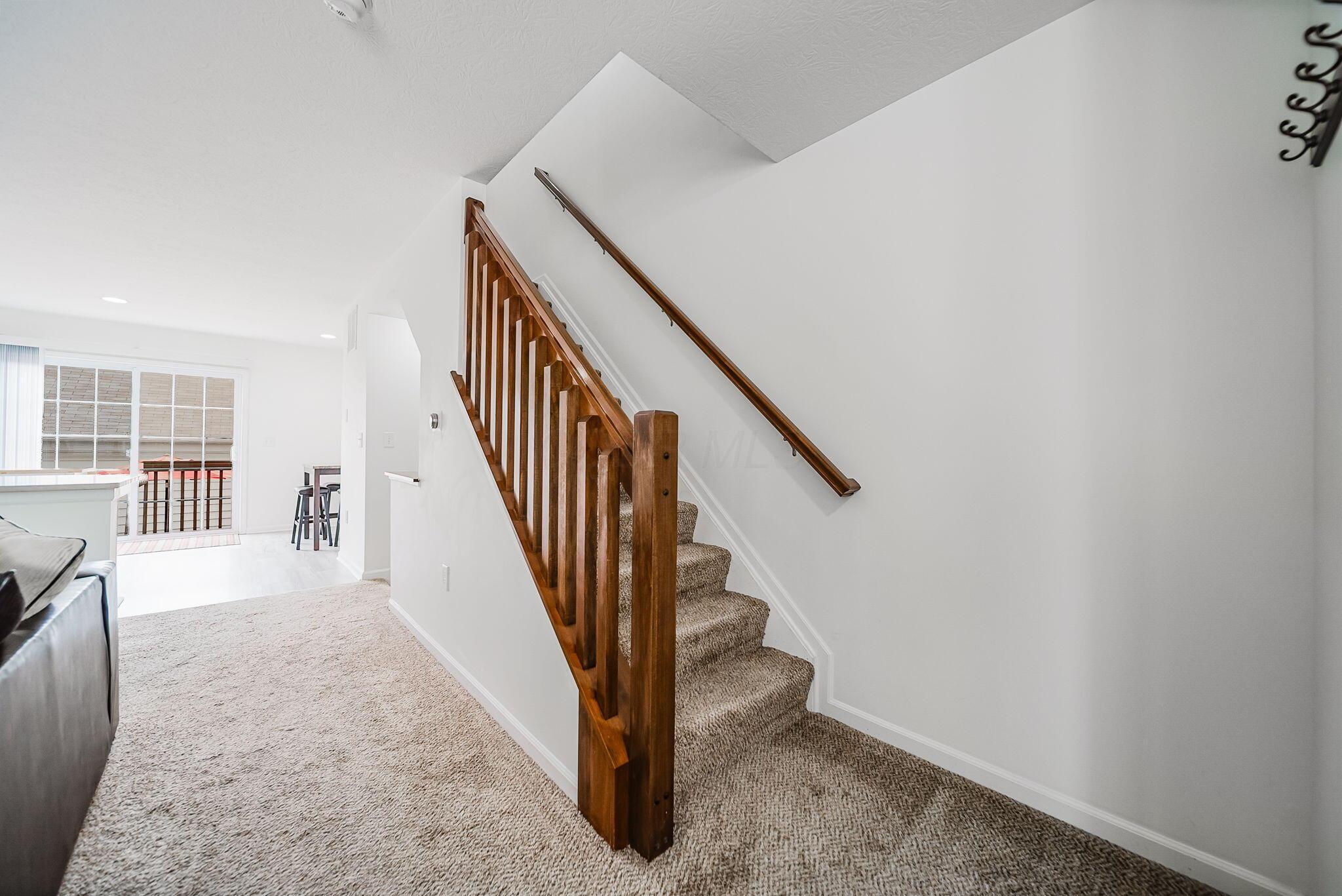 6186 Needletail Road, Unit 66 Columbus, OH 43230 - Photo 12 of 48 Craftsman style railings in warm walnut color add a touch of warmth!