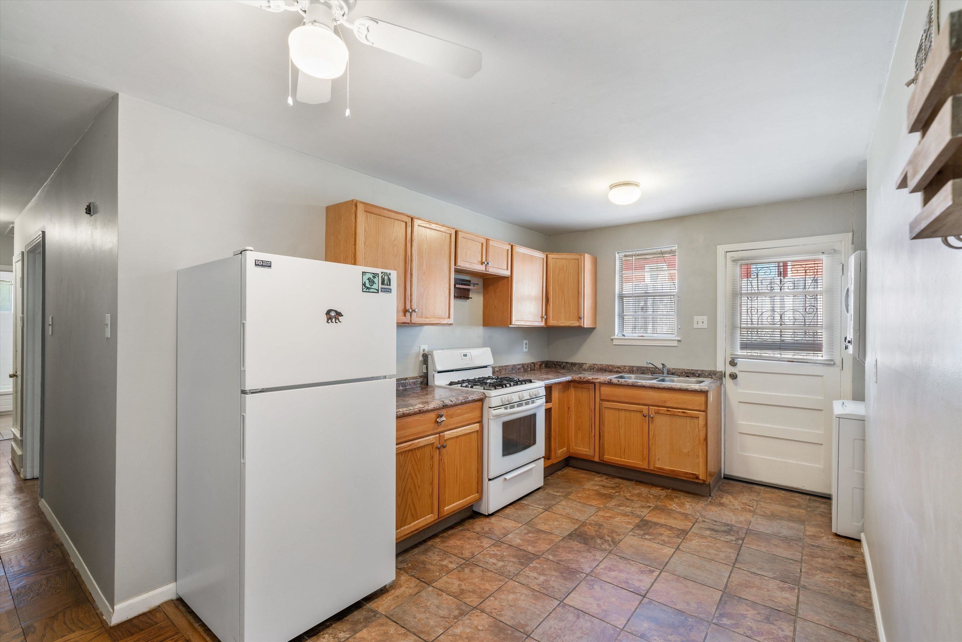 2086 Harbert Avenue Memphis, TN 38104 - Photo 12 of 16 a kitchen with a refrigerator a stove top oven and cabinets