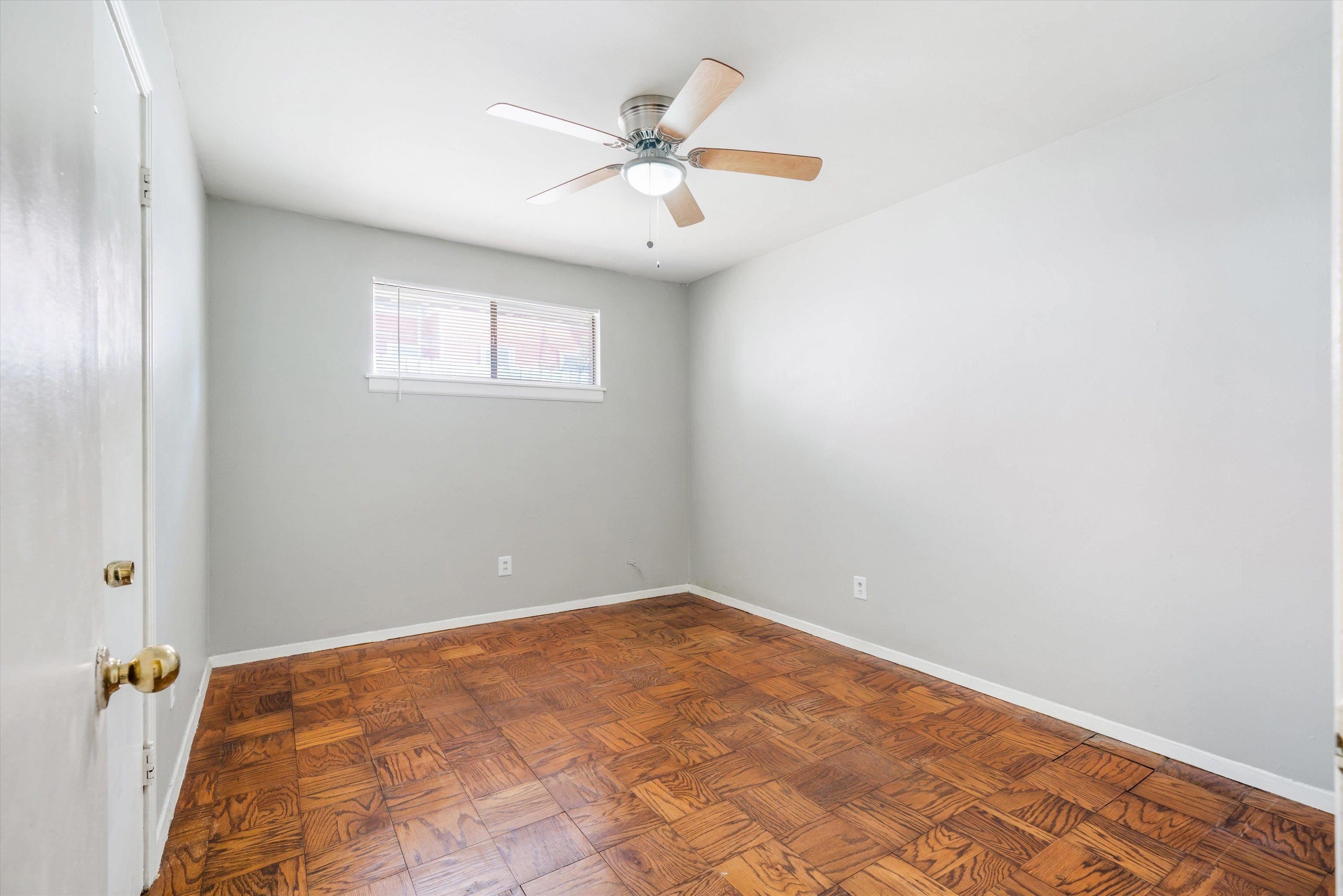 2086 Harbert Avenue Memphis, TN 38104 - Photo 13 of 16 an empty room with a window and a ceiling fan