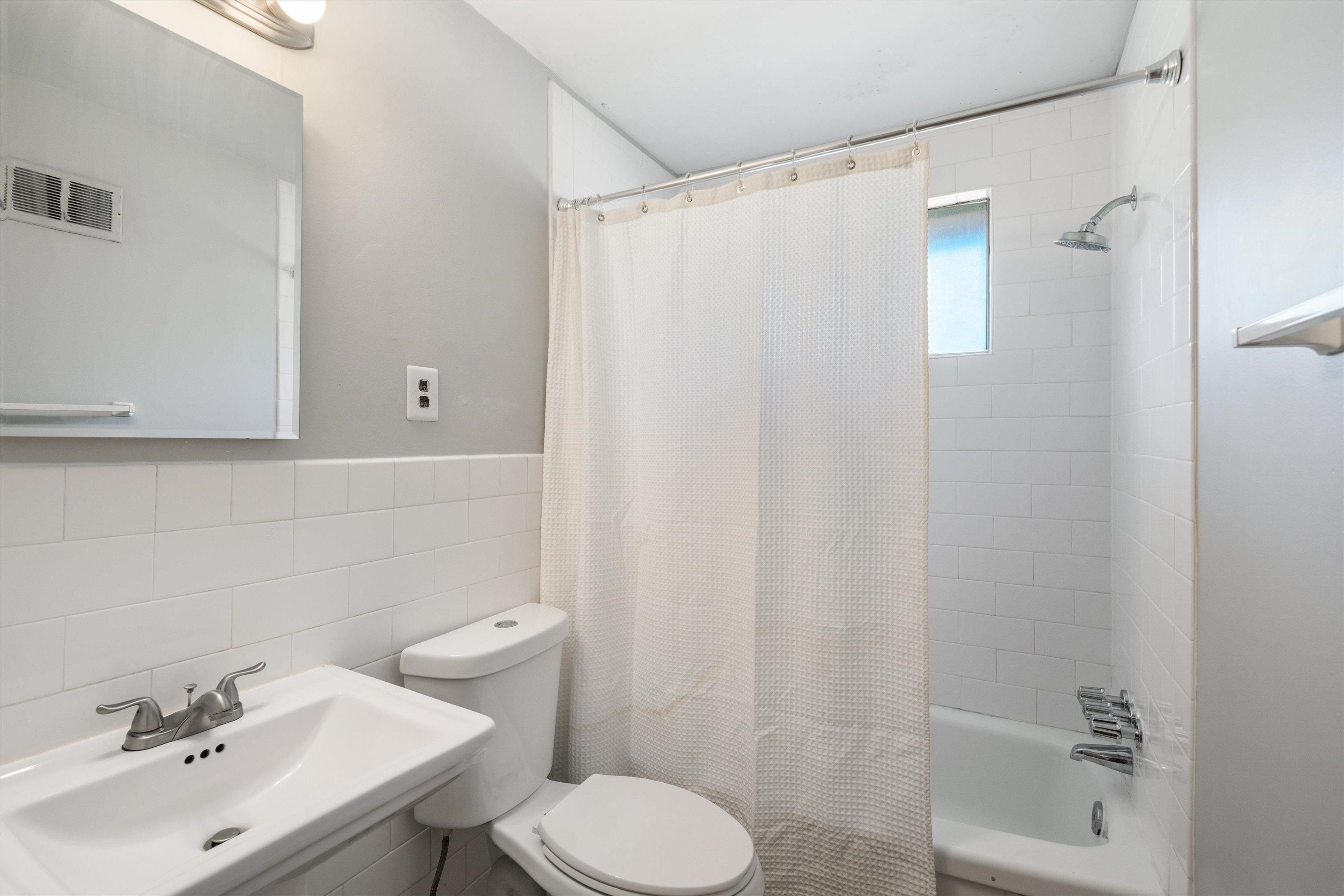 2086 Harbert Avenue Memphis, TN 38104 - Photo 16 of 16 a bathroom with a sink and a toilet