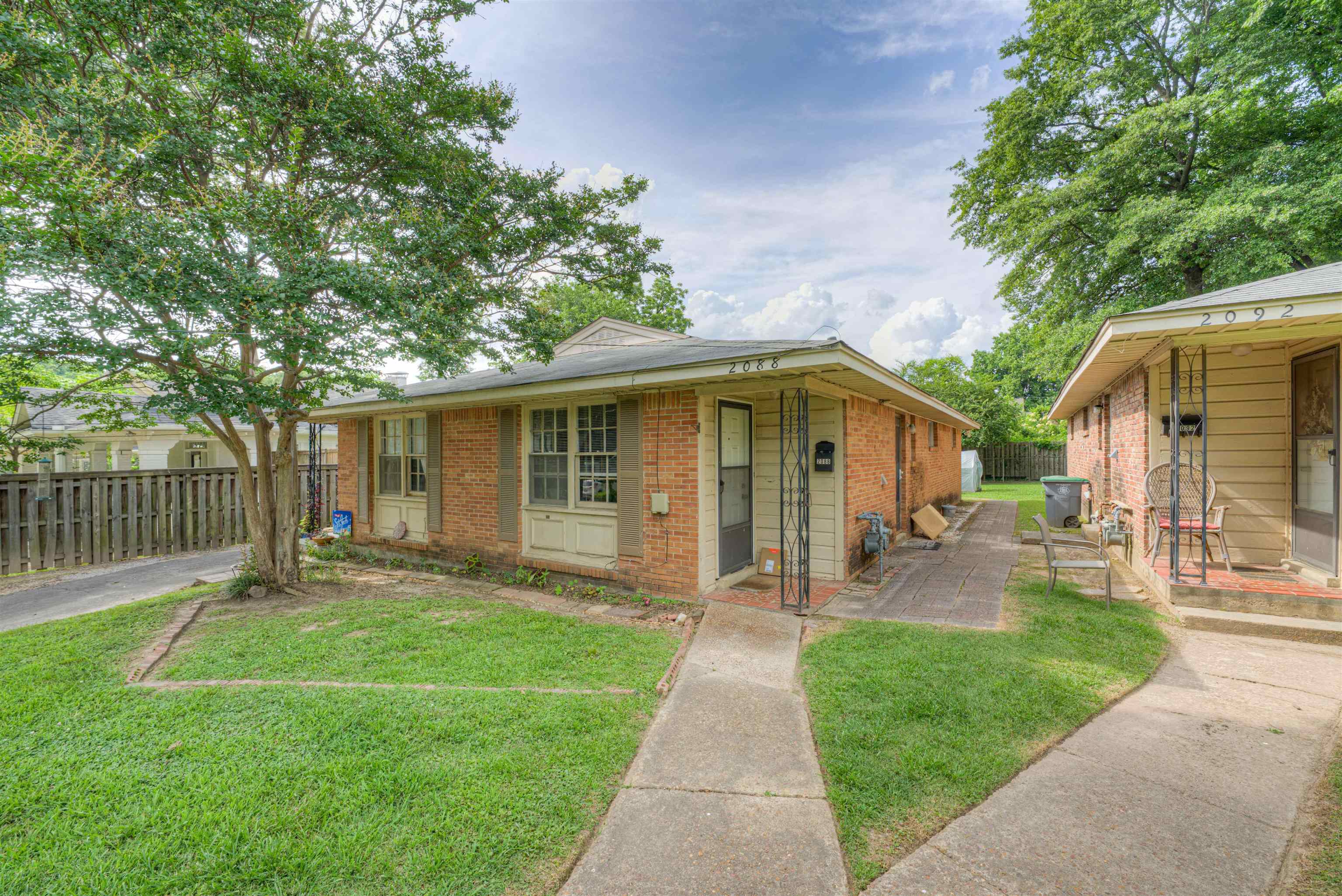2086 Harbert Avenue Memphis, TN 38104 - Photo 2 of 16 a front view of house with a garden and patio