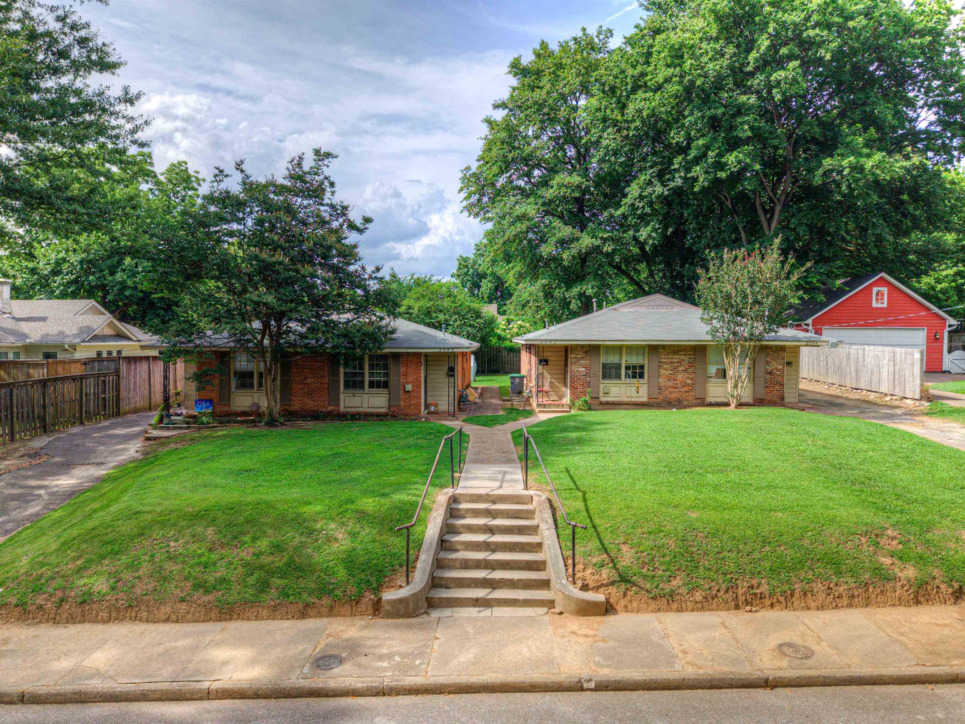 2086 Harbert Avenue Memphis, TN 38104 - Photo 4 of 16 a front view of a house with yard patio and green space