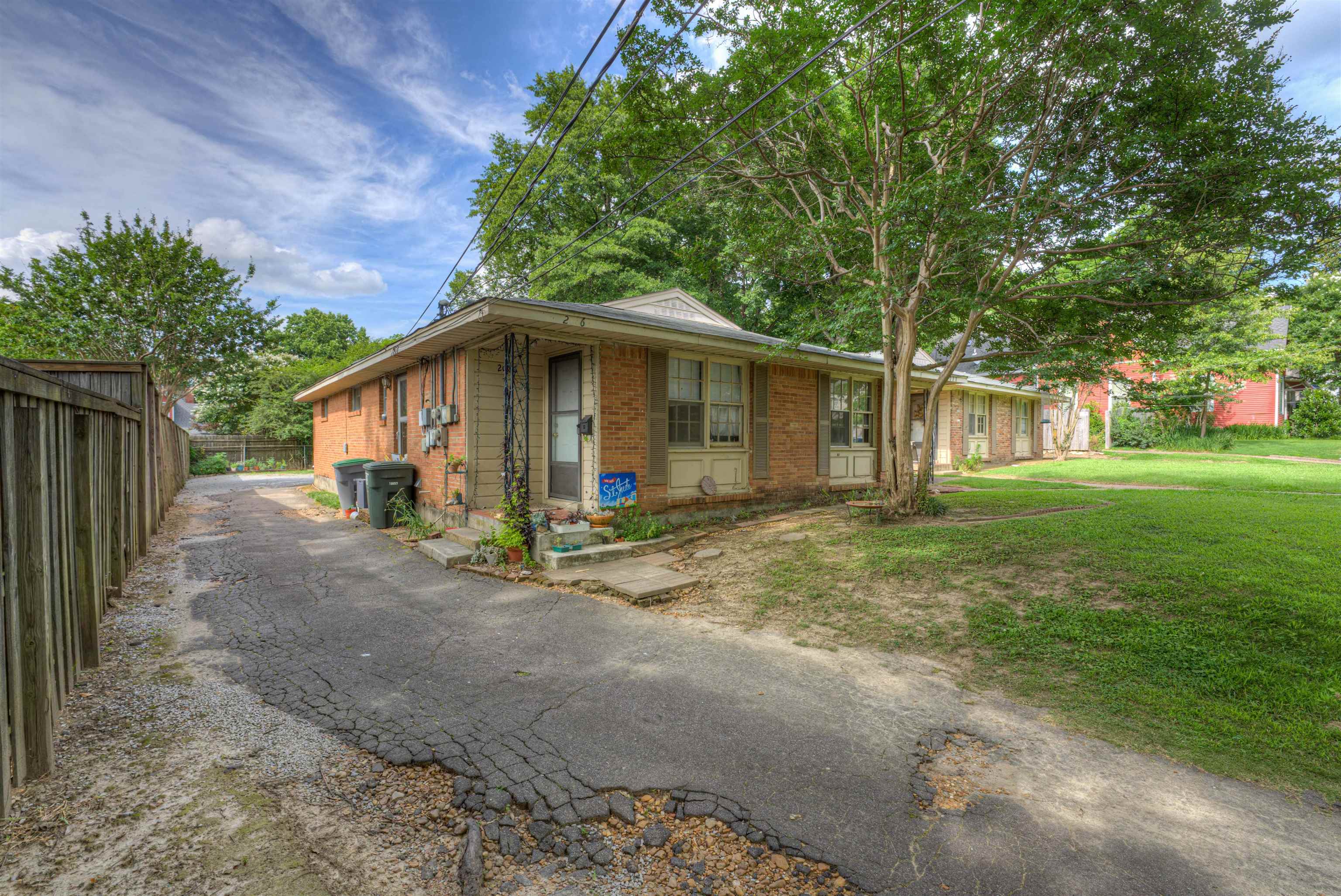 2086 Harbert Avenue Memphis, TN 38104 - Photo 6 of 16 a view of a yard with a house and a large tree