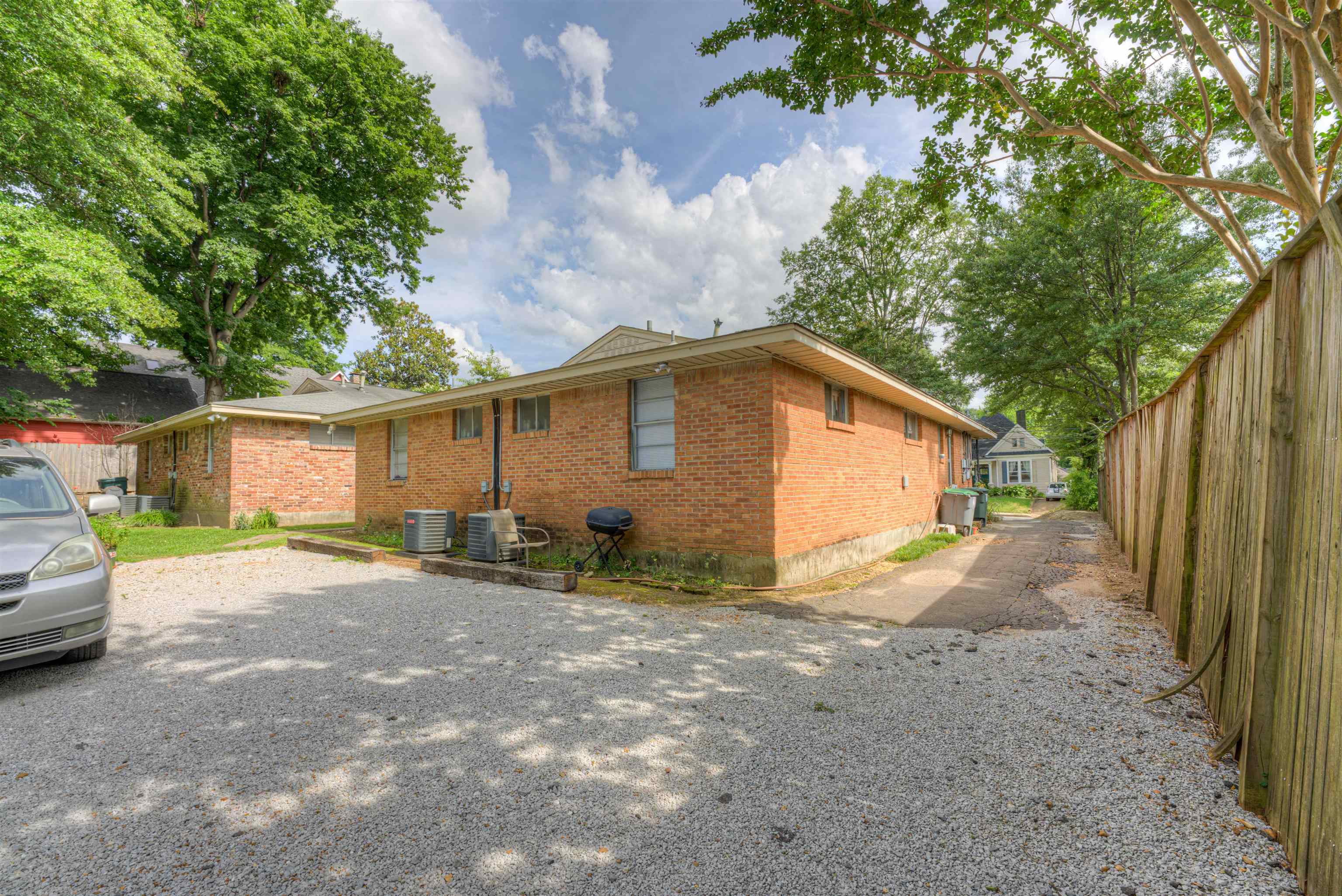 2086 Harbert Avenue Memphis, TN 38104 - Photo 7 of 16 a view of a house with a yard and garage