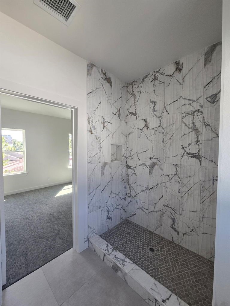 9630 Burden Street Houston, TX 77093 - Photo 13 of 15 a bathroom with a shower