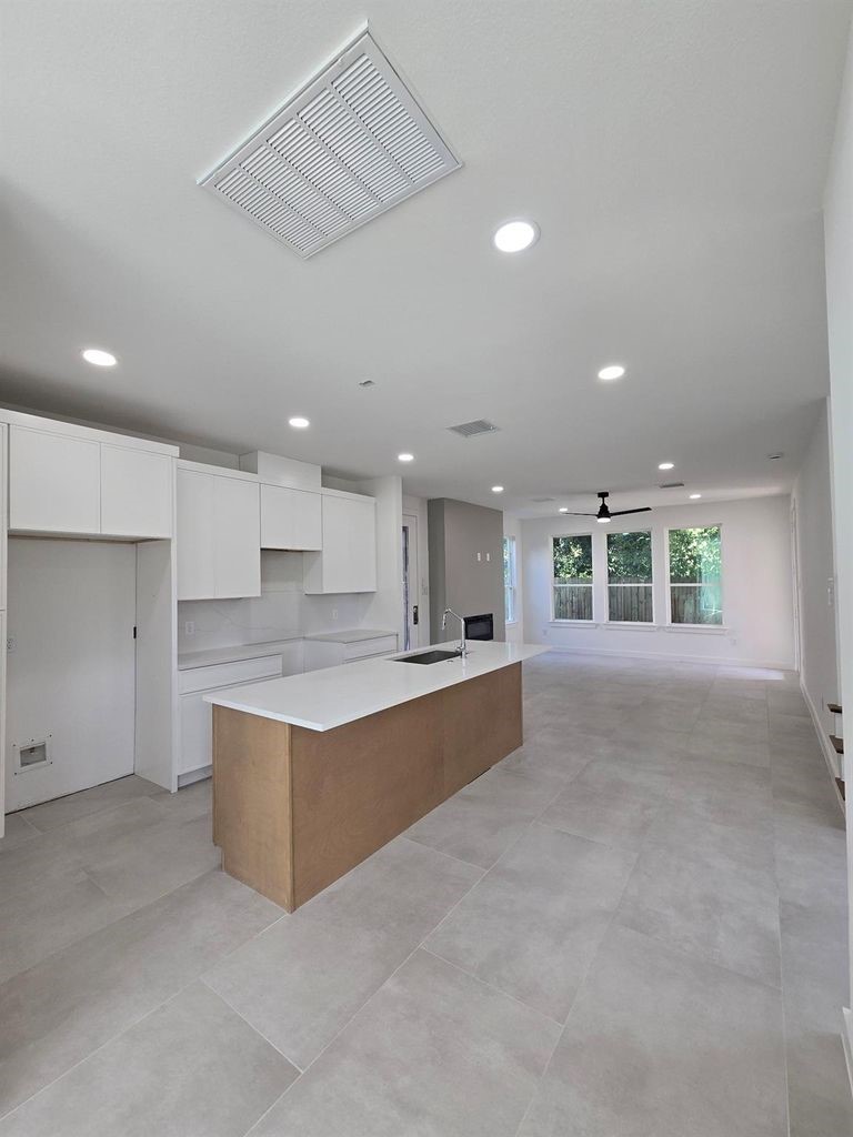9630 Burden Street Houston, TX 77093 - Photo 5 of 15 a large kitchen with stainless steel appliances granite countertop a large counter top a stove and a refrigerator