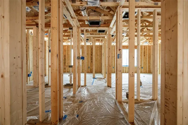 a view of a porch with a table and chairs