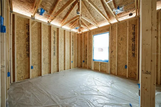 a view of an empty room with wooden frame