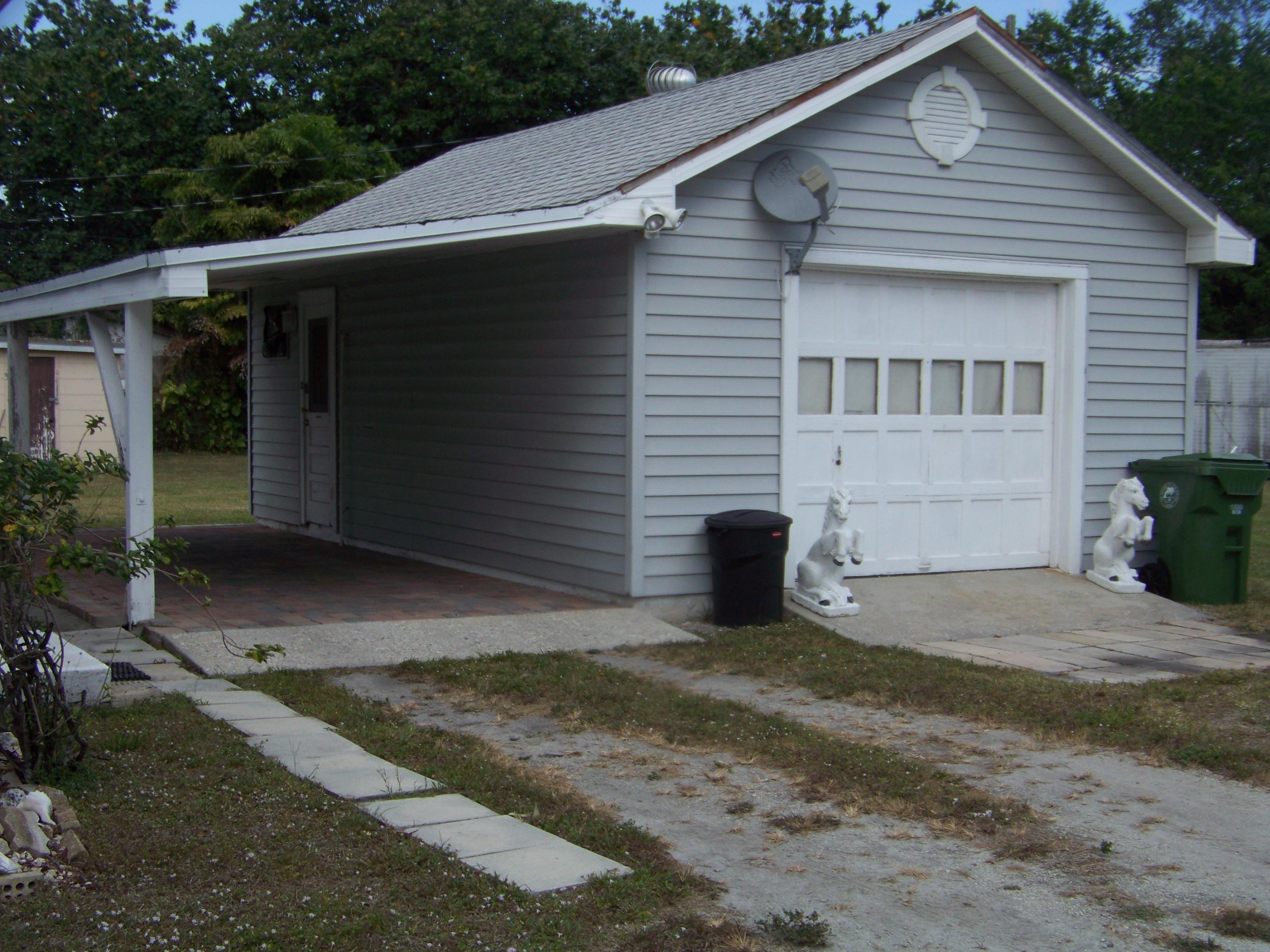 3838 Gulfstream Road Palm Springs, FL 33461 - Photo 4 of 29 Garage & Carport