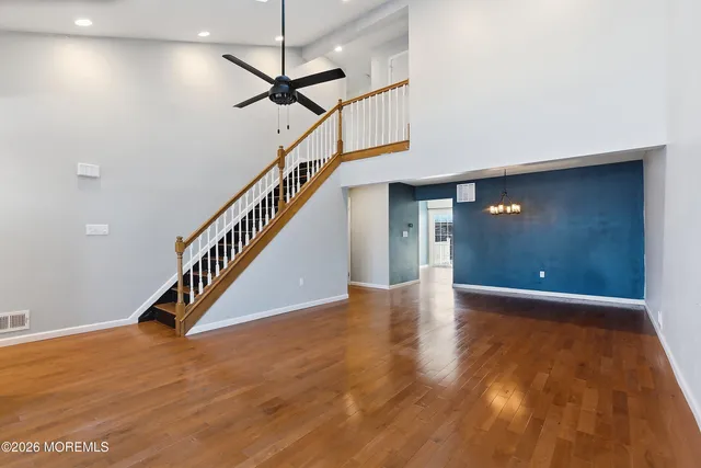 a view of an entryway with wooden floor