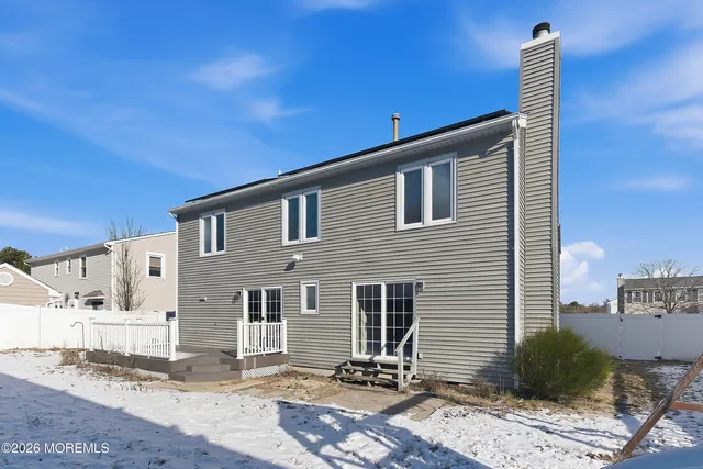 a house view with a backyard space