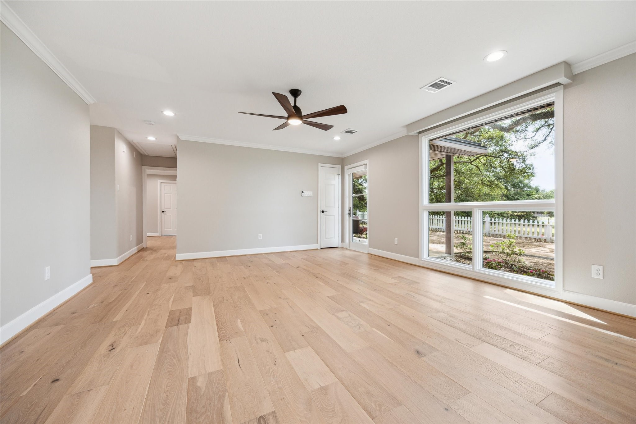 3834 Farm To Market Road 949 Cat Spring, TX 78933 - Photo 15 of 50 a view of an empty room with a window and a ceiling fan