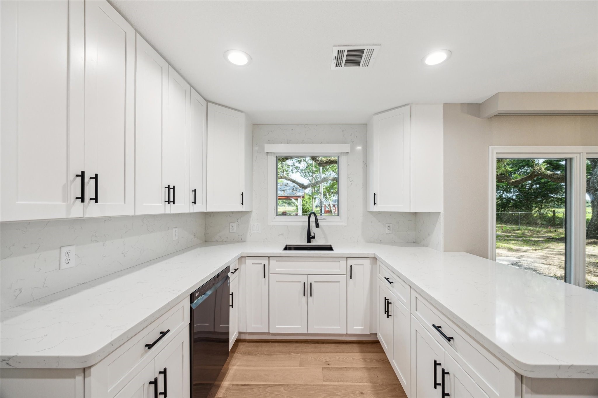 3834 Farm To Market Road 949 Cat Spring, TX 78933 - Photo 19 of 50 a kitchen with white cabinets and white appliances