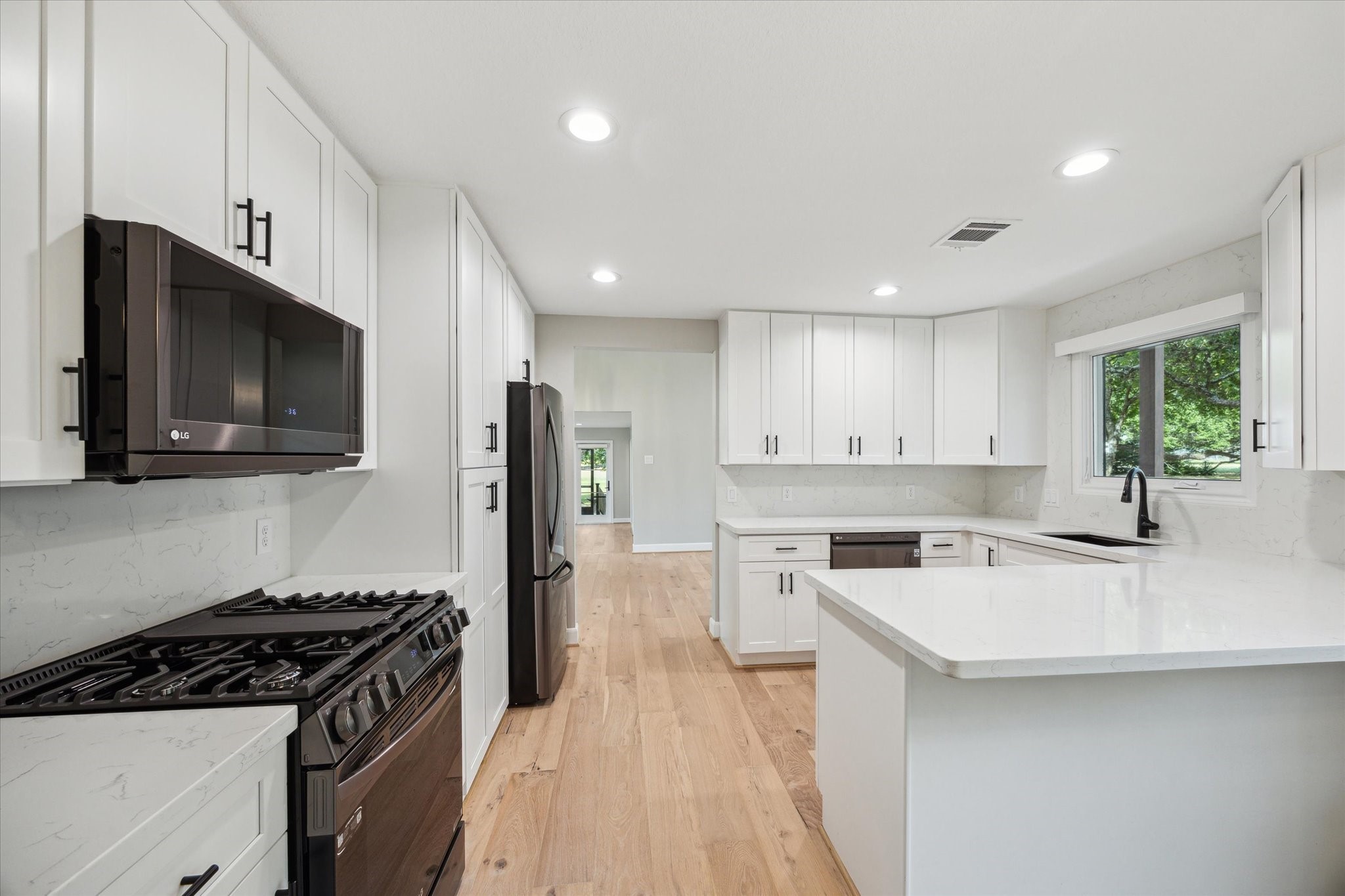 3834 Farm To Market Road 949 Cat Spring, TX 78933 - Photo 20 of 50 a kitchen with a sink stove top oven and refrigerator