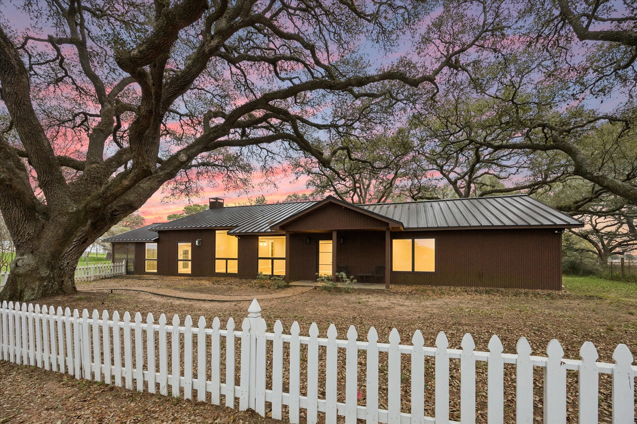 3834 Farm To Market Road 949 Cat Spring, TX 78933 - Photo 2 of 50 a front view of a house with a garden