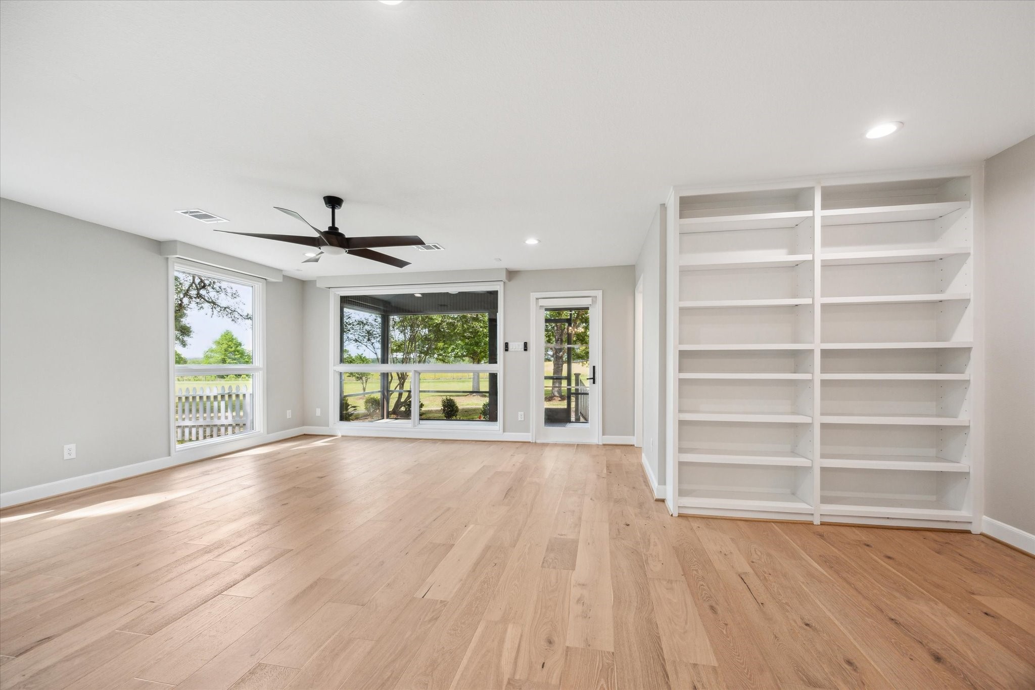 3834 Farm To Market Road 949 Cat Spring, TX 78933 - Photo 22 of 50 a view of an empty room with a window and wooden floor