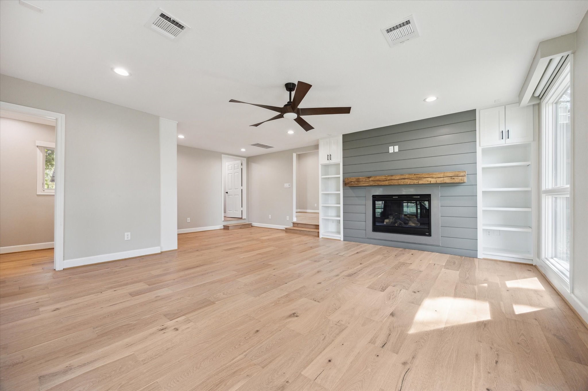 3834 Farm To Market Road 949 Cat Spring, TX 78933 - Photo 24 of 50 an empty room with fireplace and wooden floor