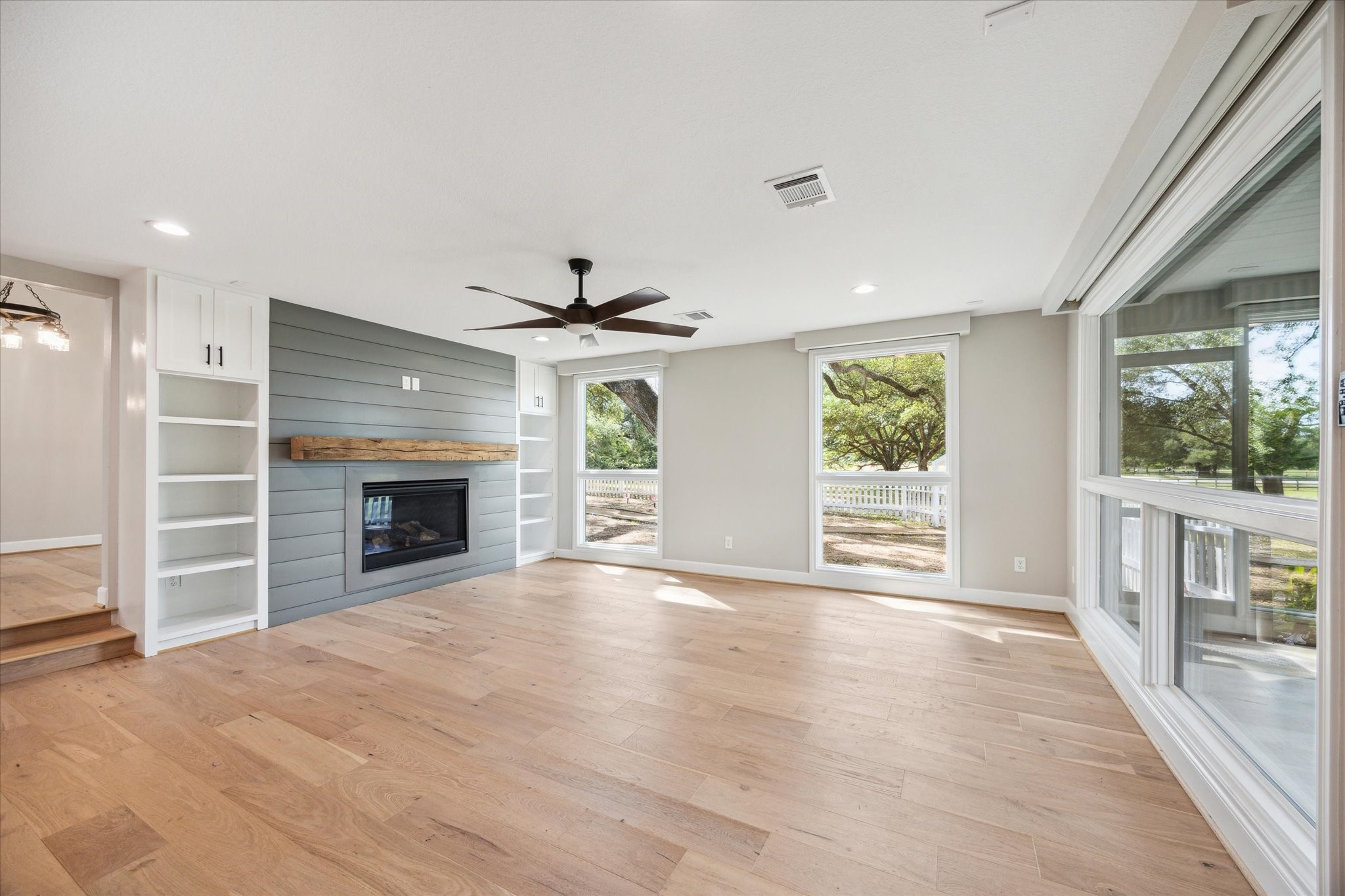 3834 Farm To Market Road 949 Cat Spring, TX 78933 - Photo 26 of 50 a view of an empty room with a fireplace and a window