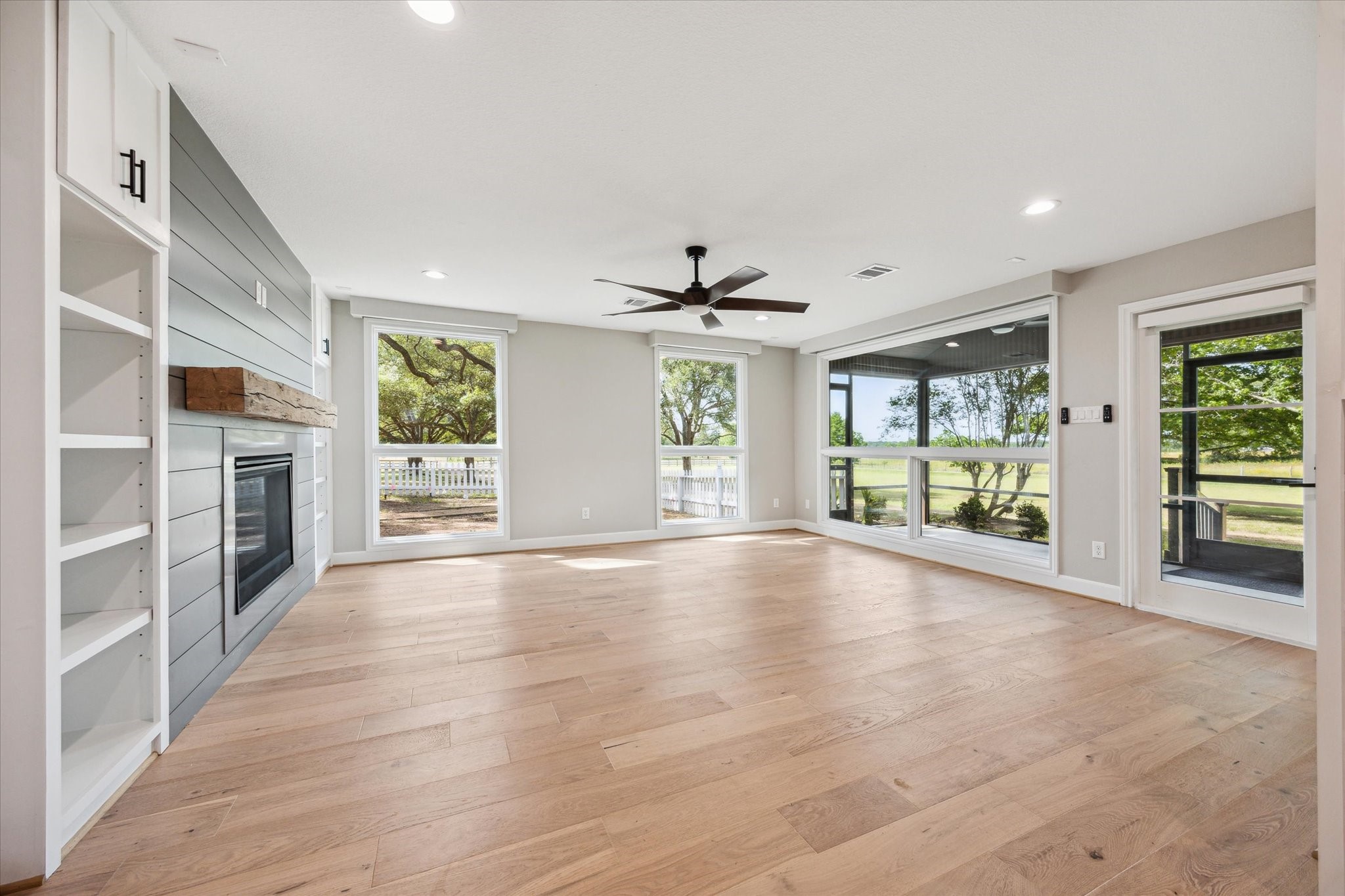 3834 Farm To Market Road 949 Cat Spring, TX 78933 - Photo 27 of 50 a view of an empty room with a window and wooden floor