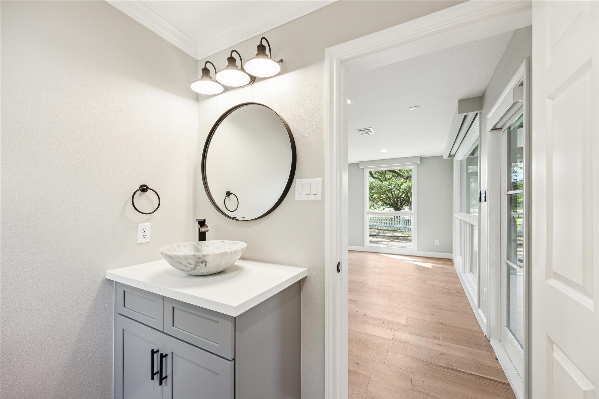 3834 Farm To Market Road 949 Cat Spring, TX 78933 - Photo 29 of 50 a bathroom with a toilet a sink and a mirror