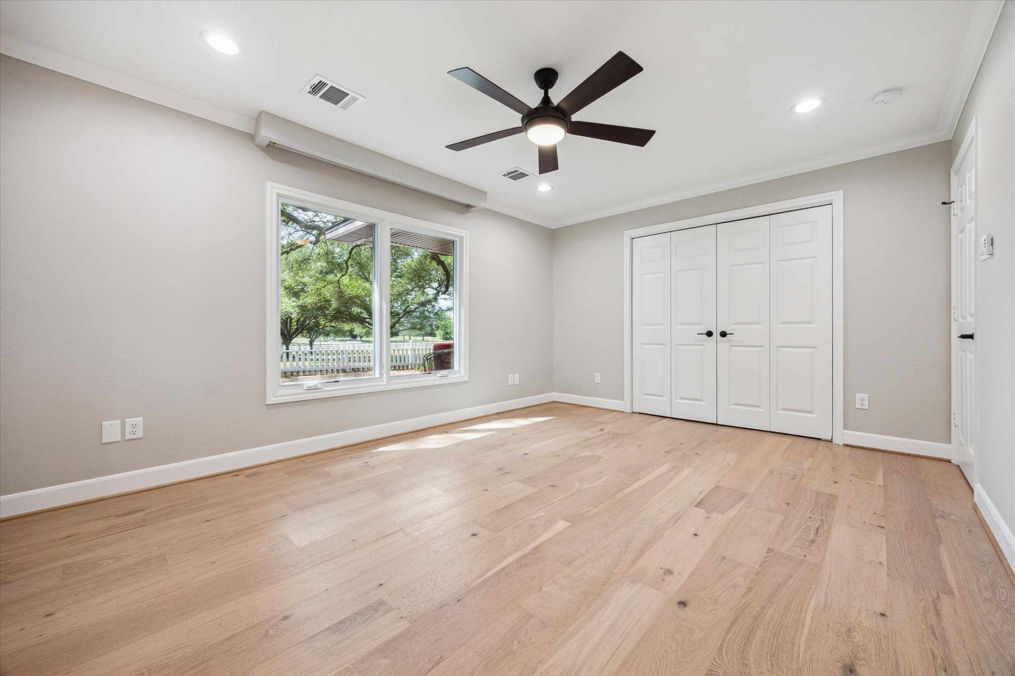 3834 Farm To Market Road 949 Cat Spring, TX 78933 - Photo 31 of 50 an empty room with wooden floor and windows