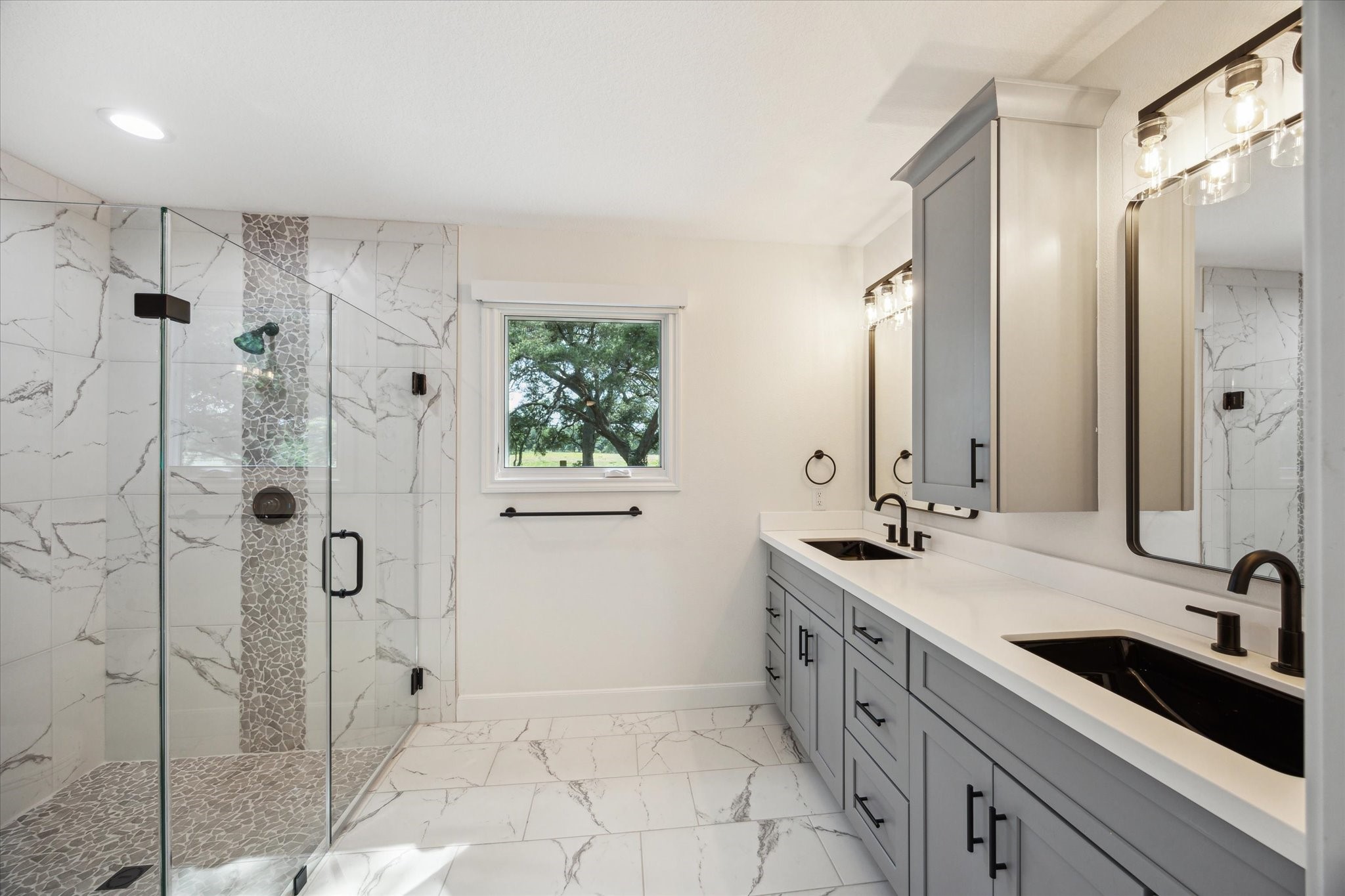 3834 Farm To Market Road 949 Cat Spring, TX 78933 - Photo 32 of 50 a spacious bathroom with a shower sink and mirror