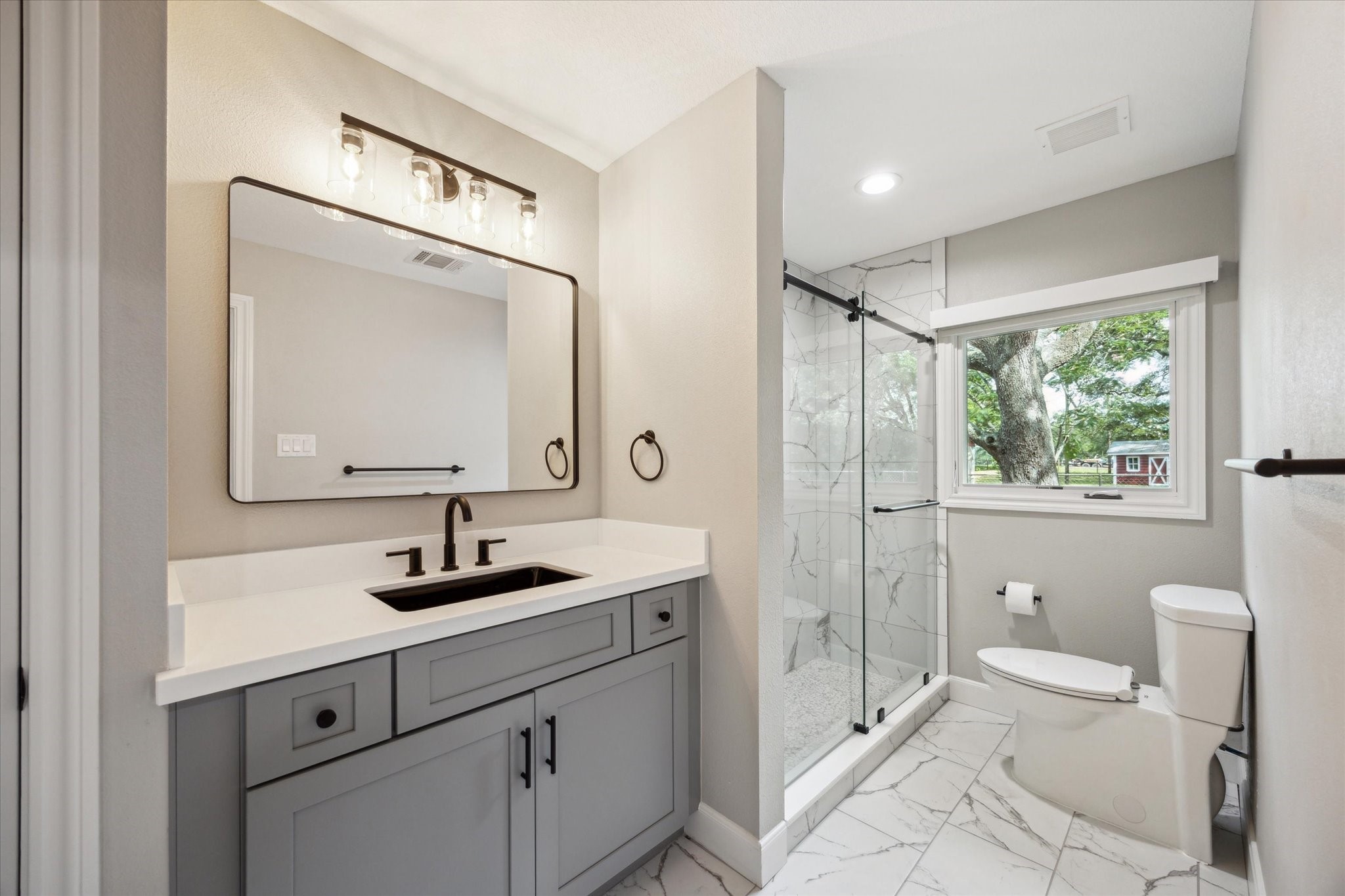 3834 Farm To Market Road 949 Cat Spring, TX 78933 - Photo 38 of 50 a bathroom with a toilet sink and mirror